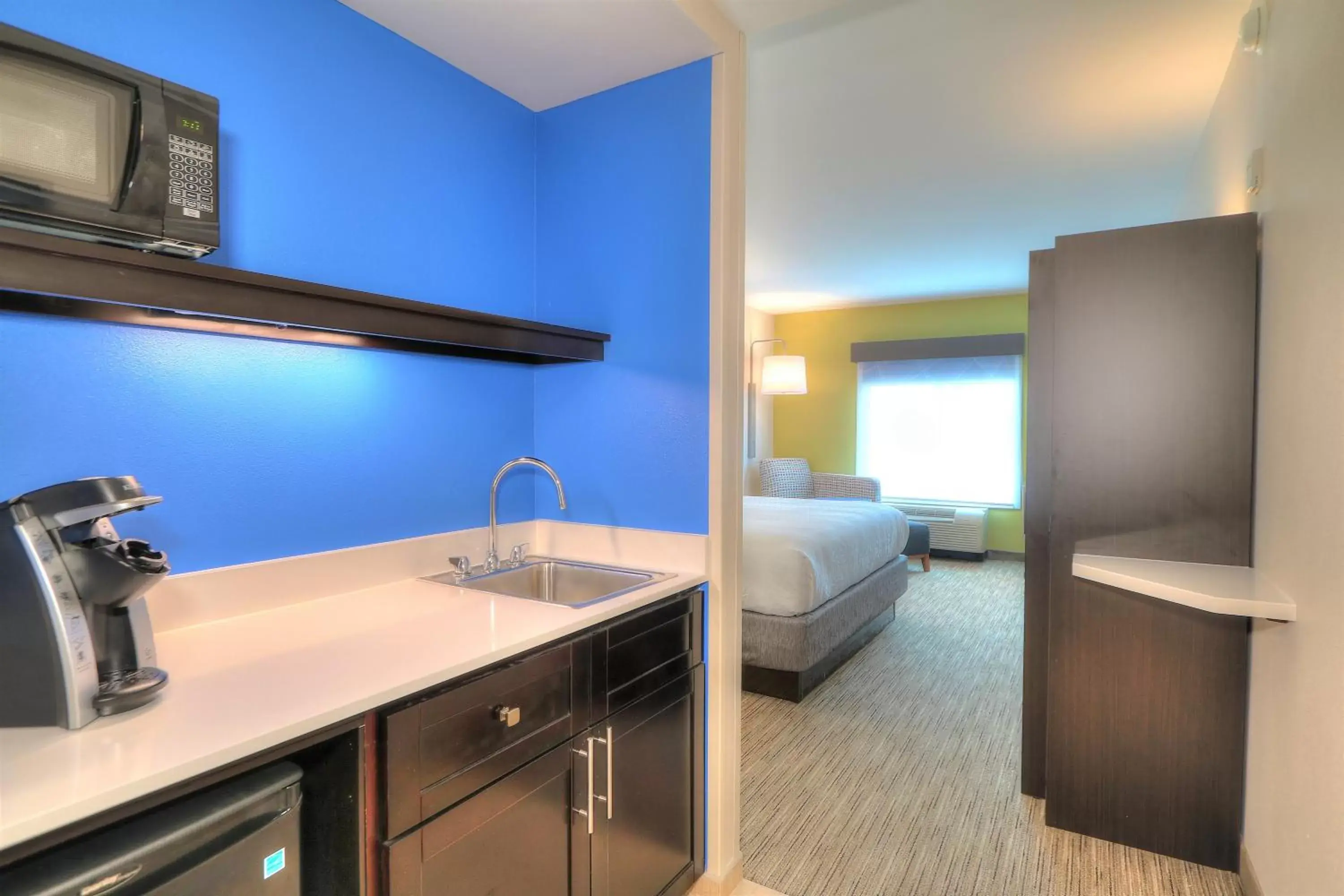 Photo of the whole room, Kitchen/Kitchenette in Holiday Inn Express Hotel & Suites Mobile Saraland, an IHG Hotel