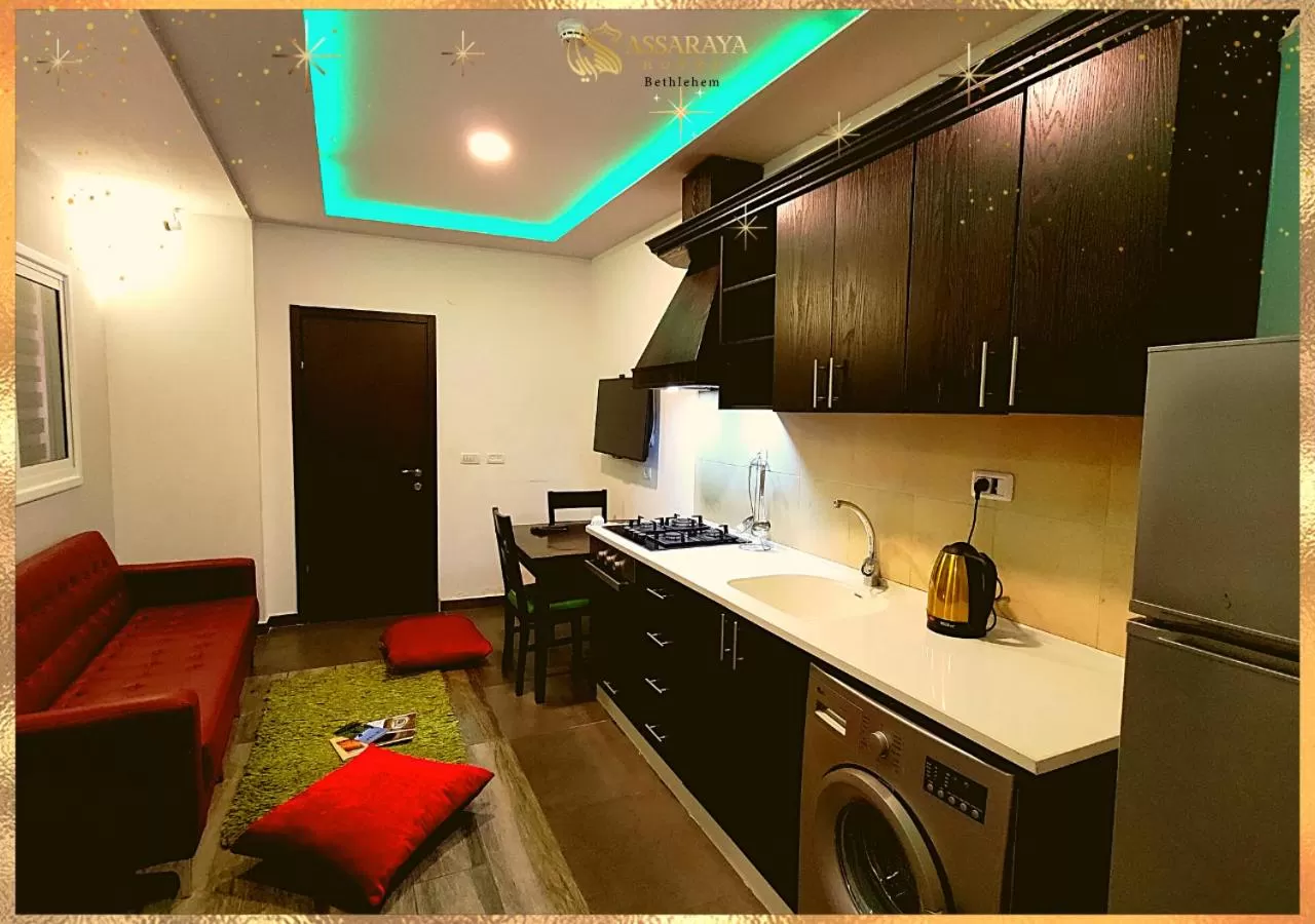 Kitchen or kitchenette in Assaraya Palace Hotel