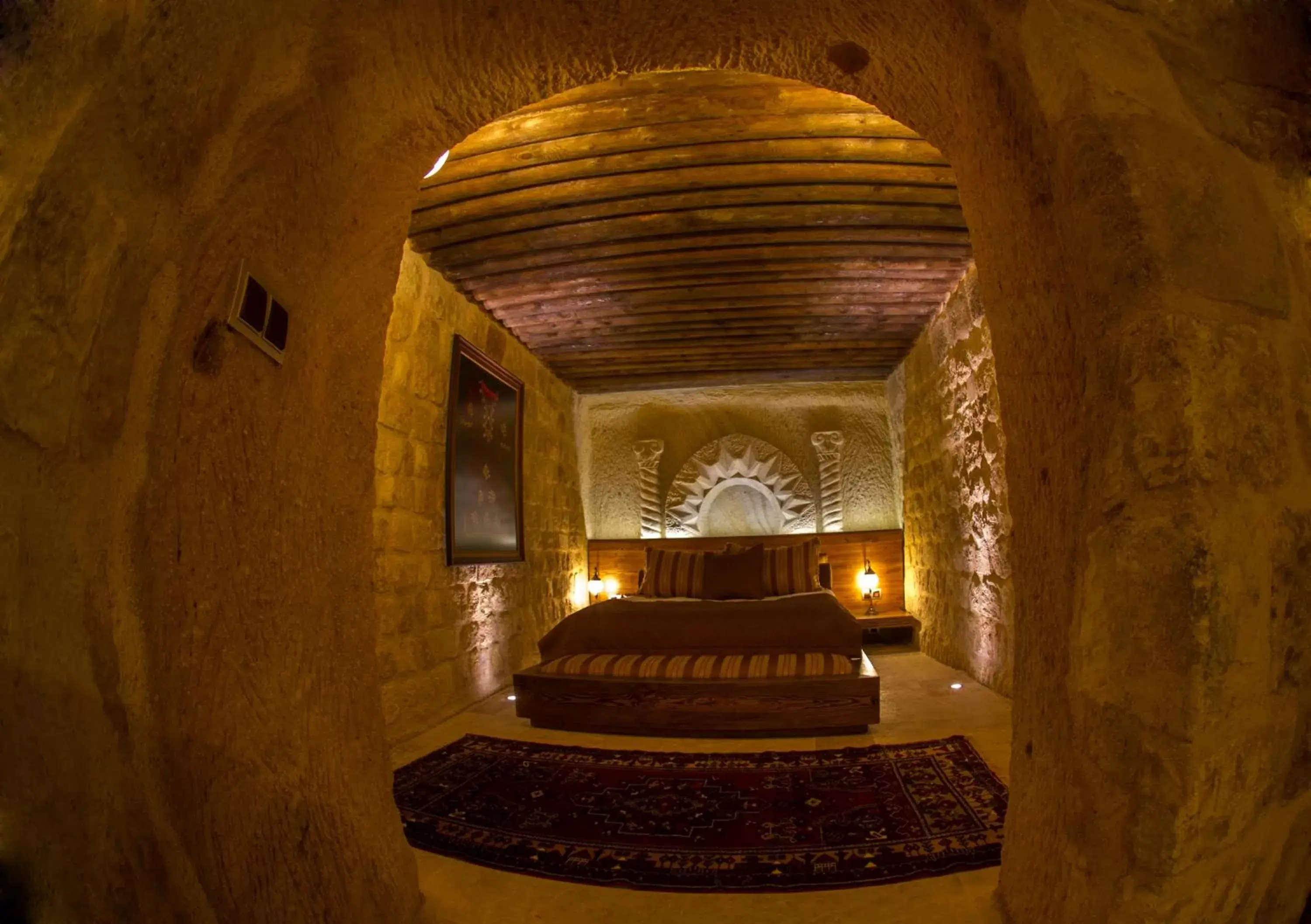 Bed in Kayakapi Premium Caves Cappadocia