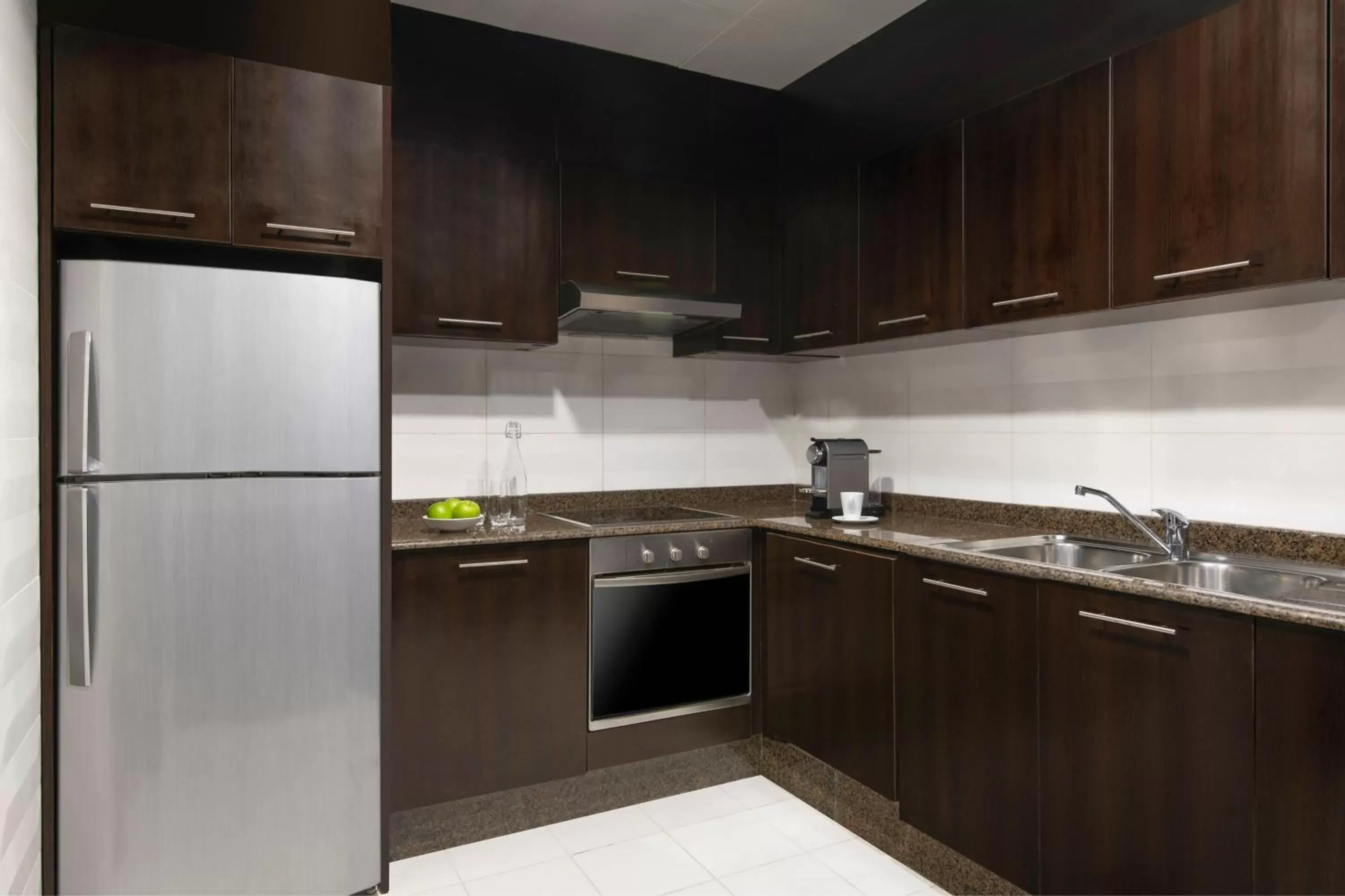 Bedroom, Kitchen/Kitchenette in Marriott Executive Apartments City Center Doha