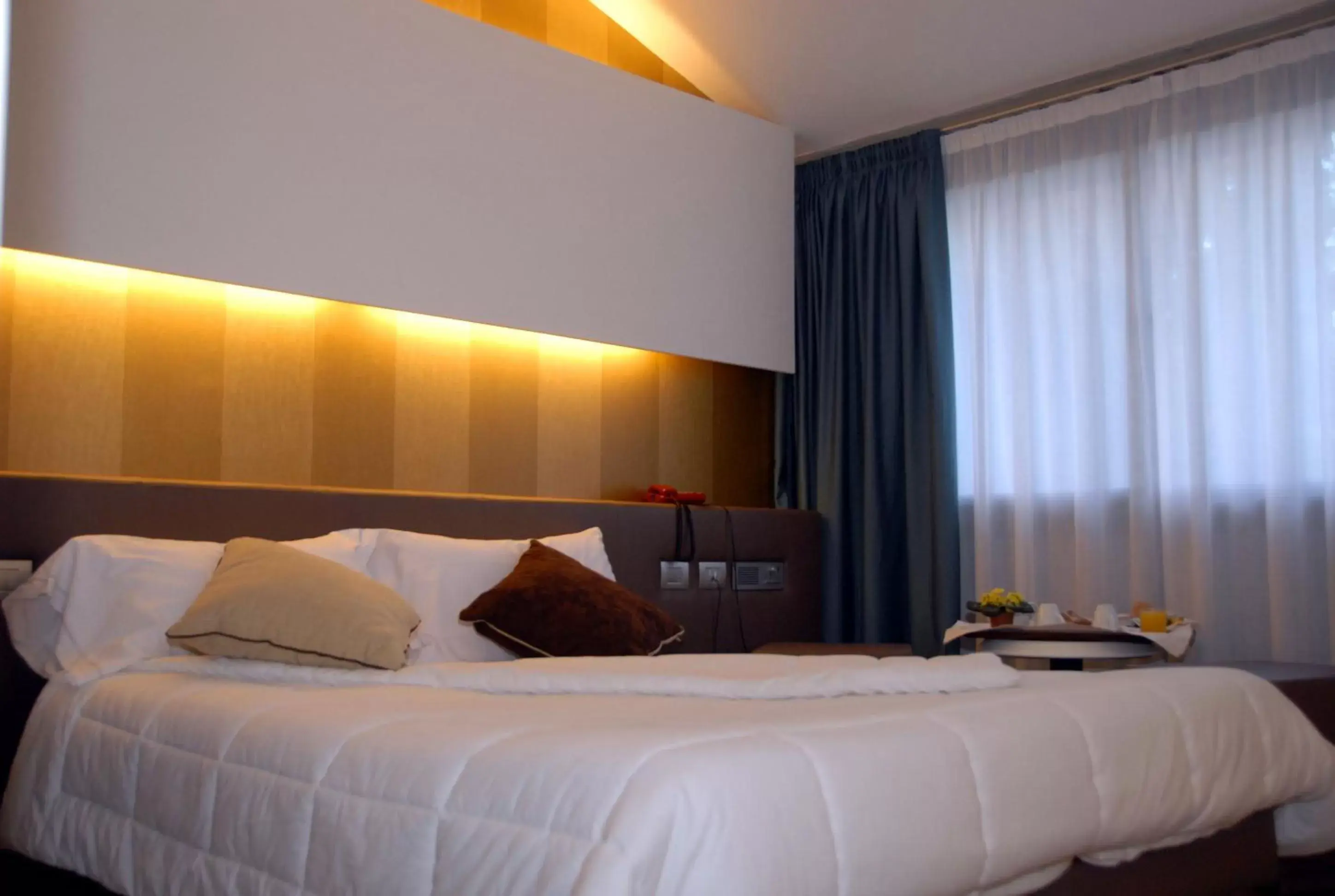 Bed in Green Hotel Motel
