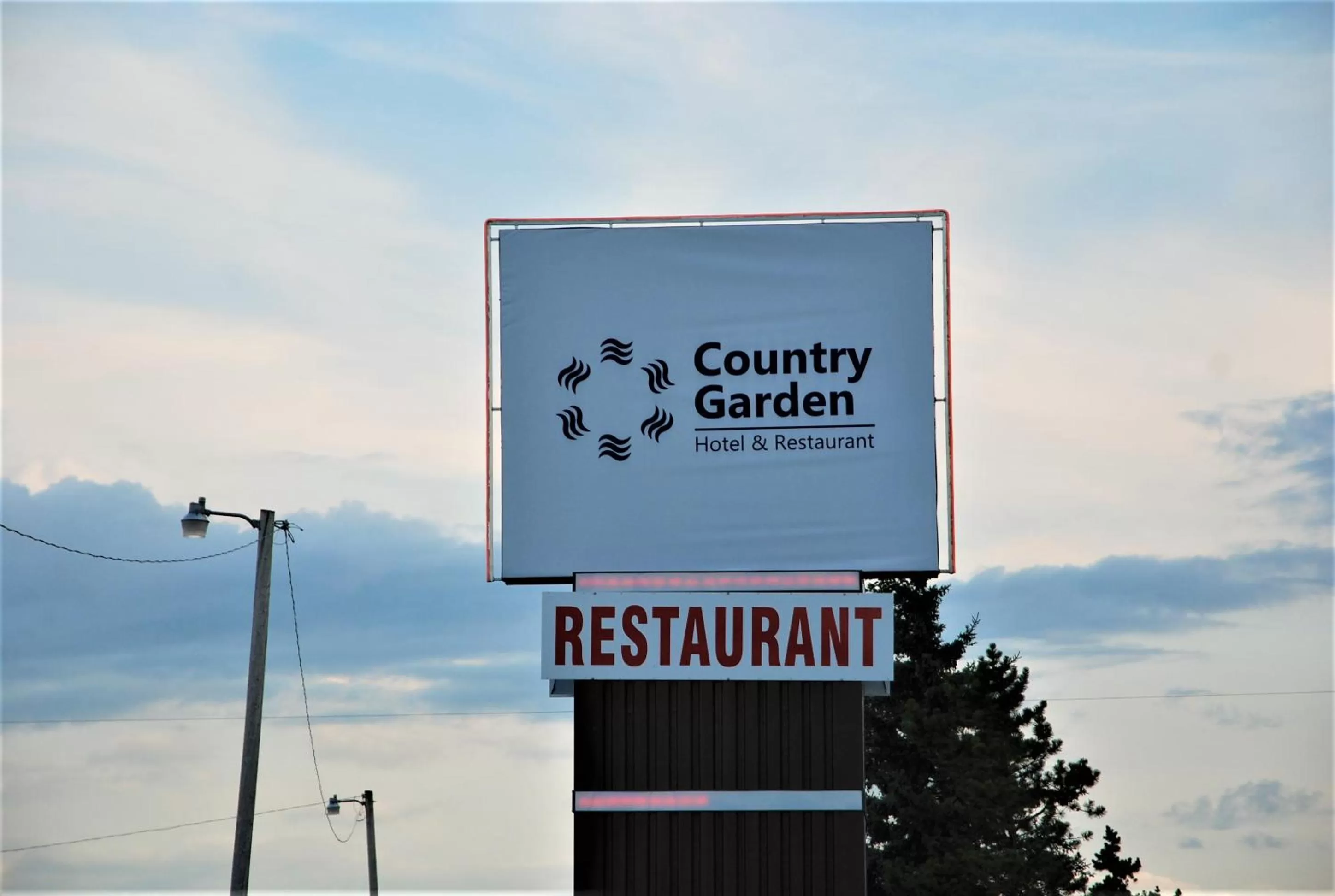 Property logo or sign in Country Garden Inn & Restaurant