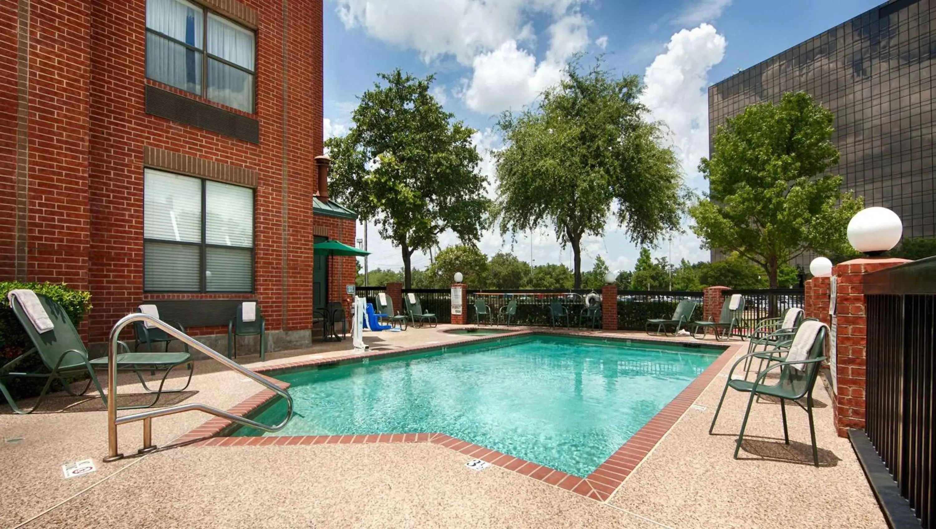 Swimming Pool in SureStay Plus Hotel by Best Western Plano