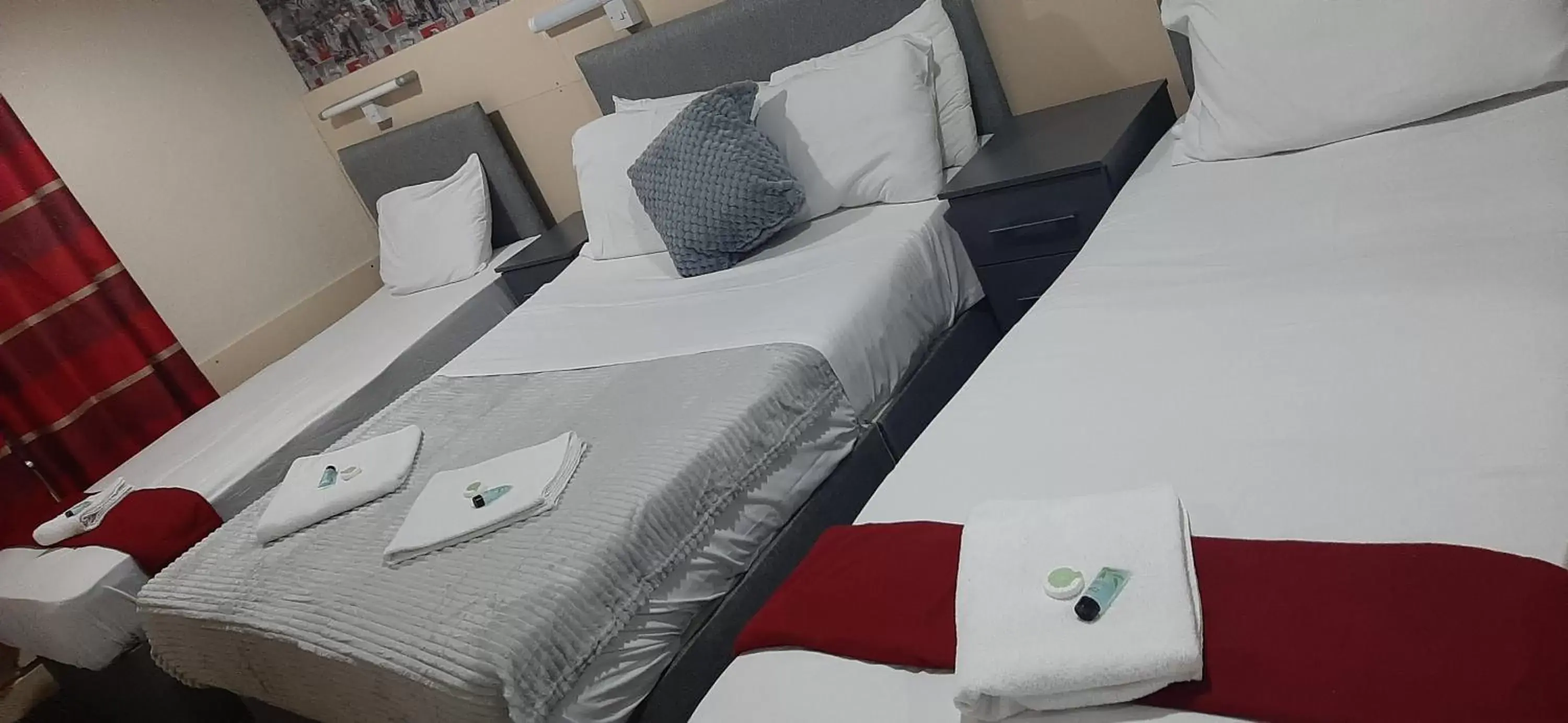 Bed in PRESTIGE PLAZA Hotel