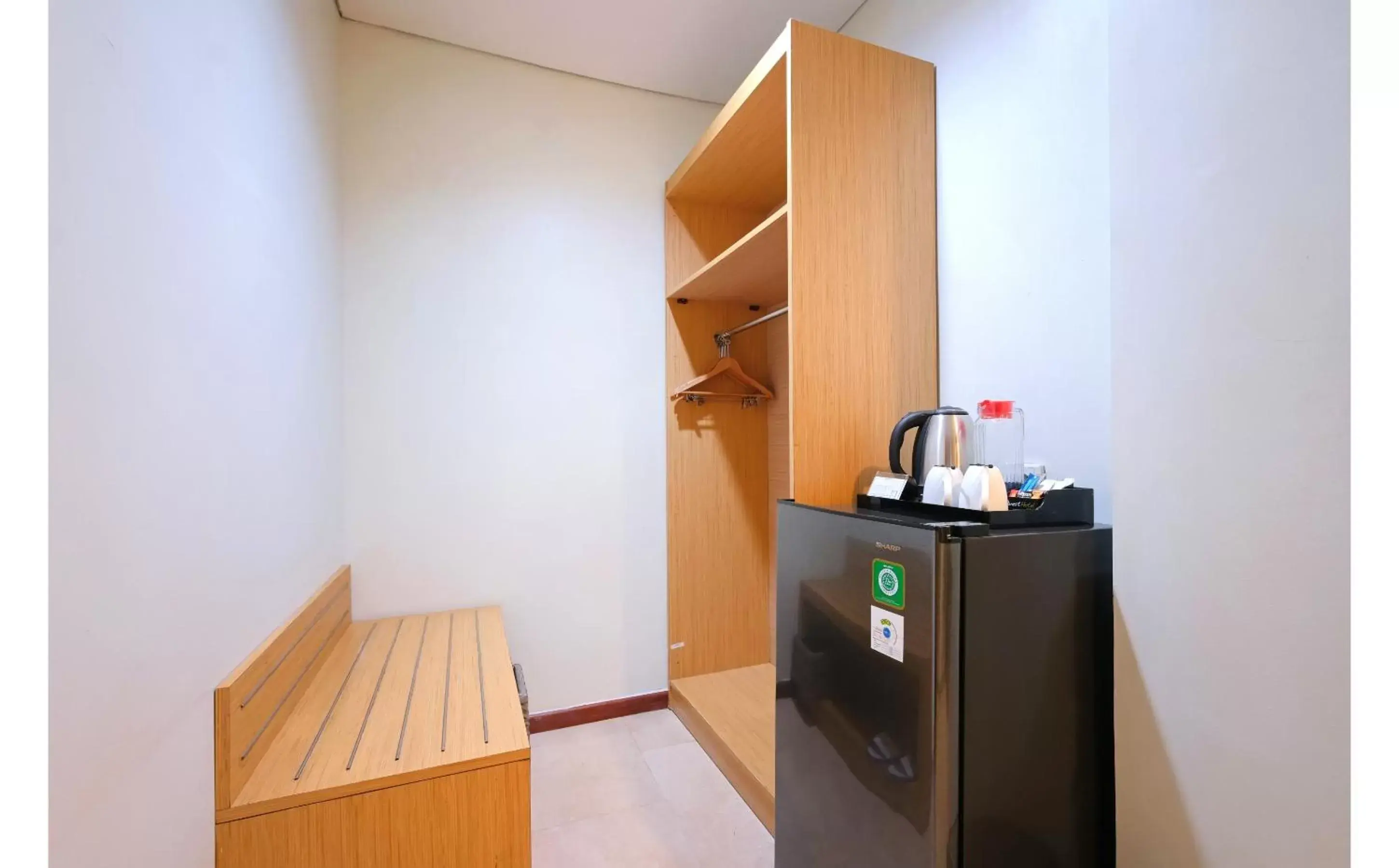 wardrobe, TV/Entertainment Center in Quest Hotel Simpang Lima - Semarang by ASTON