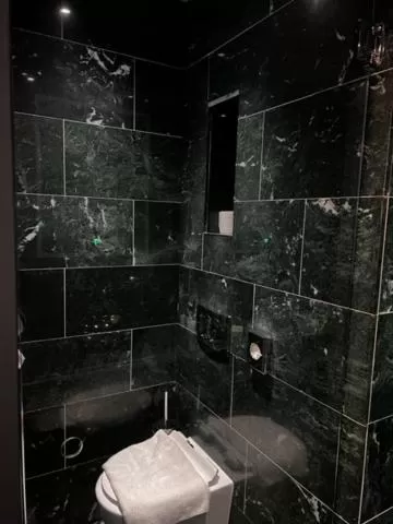Bathroom in Triple G Hotels