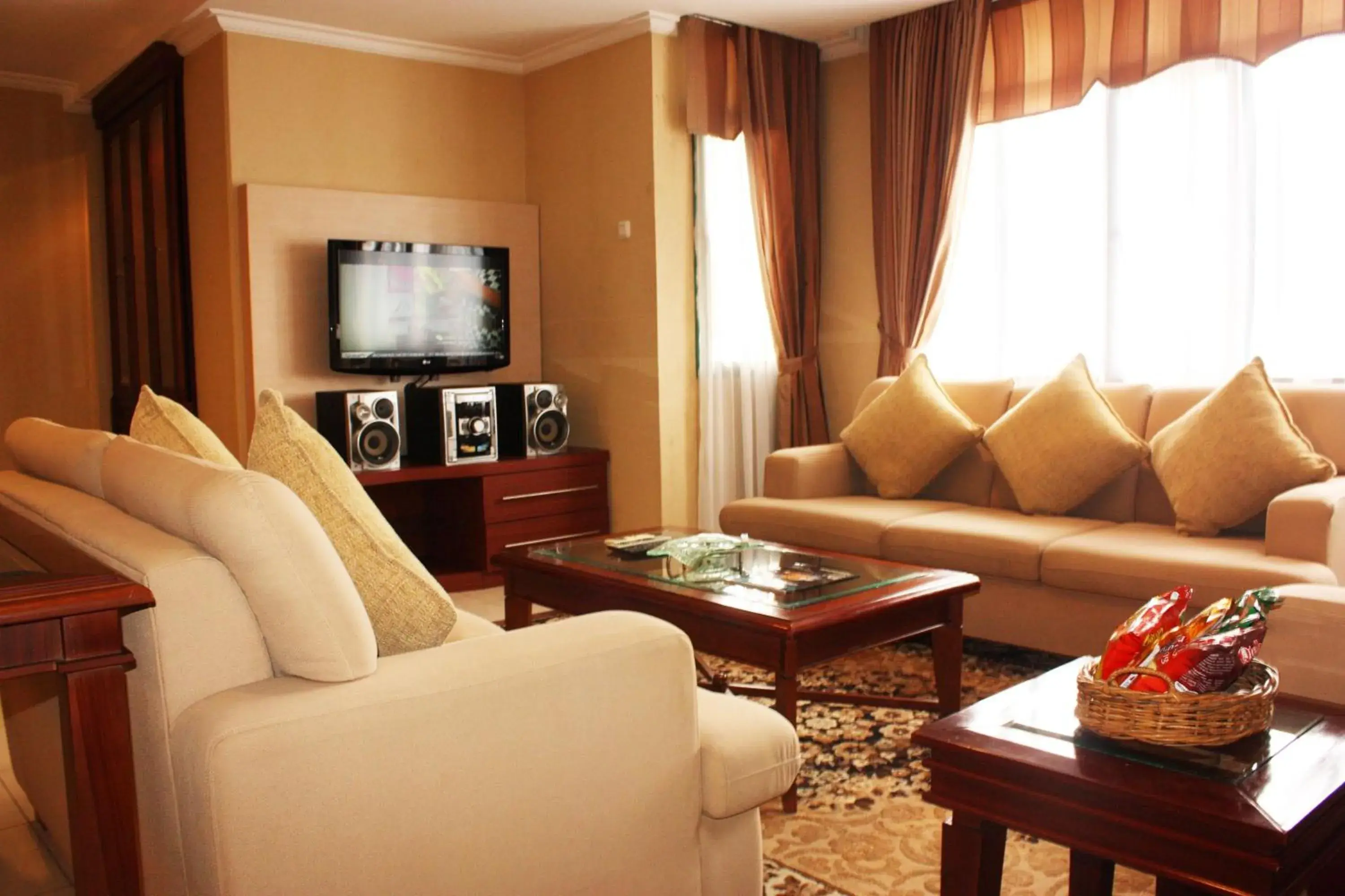 TV and multimedia, Seating Area in Travellers Suites Serviced Apartments
