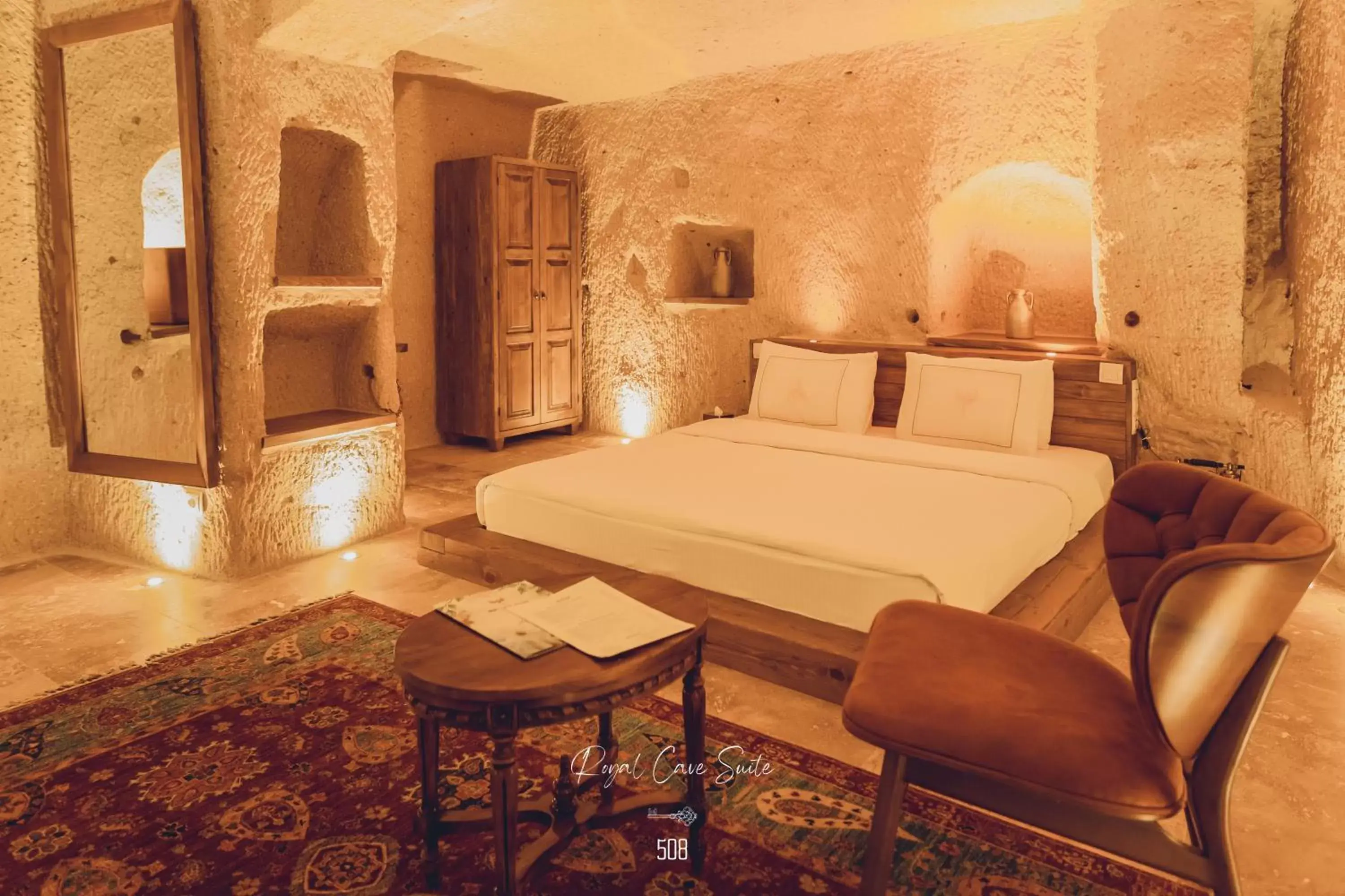 Bed in Nino Cave Suites