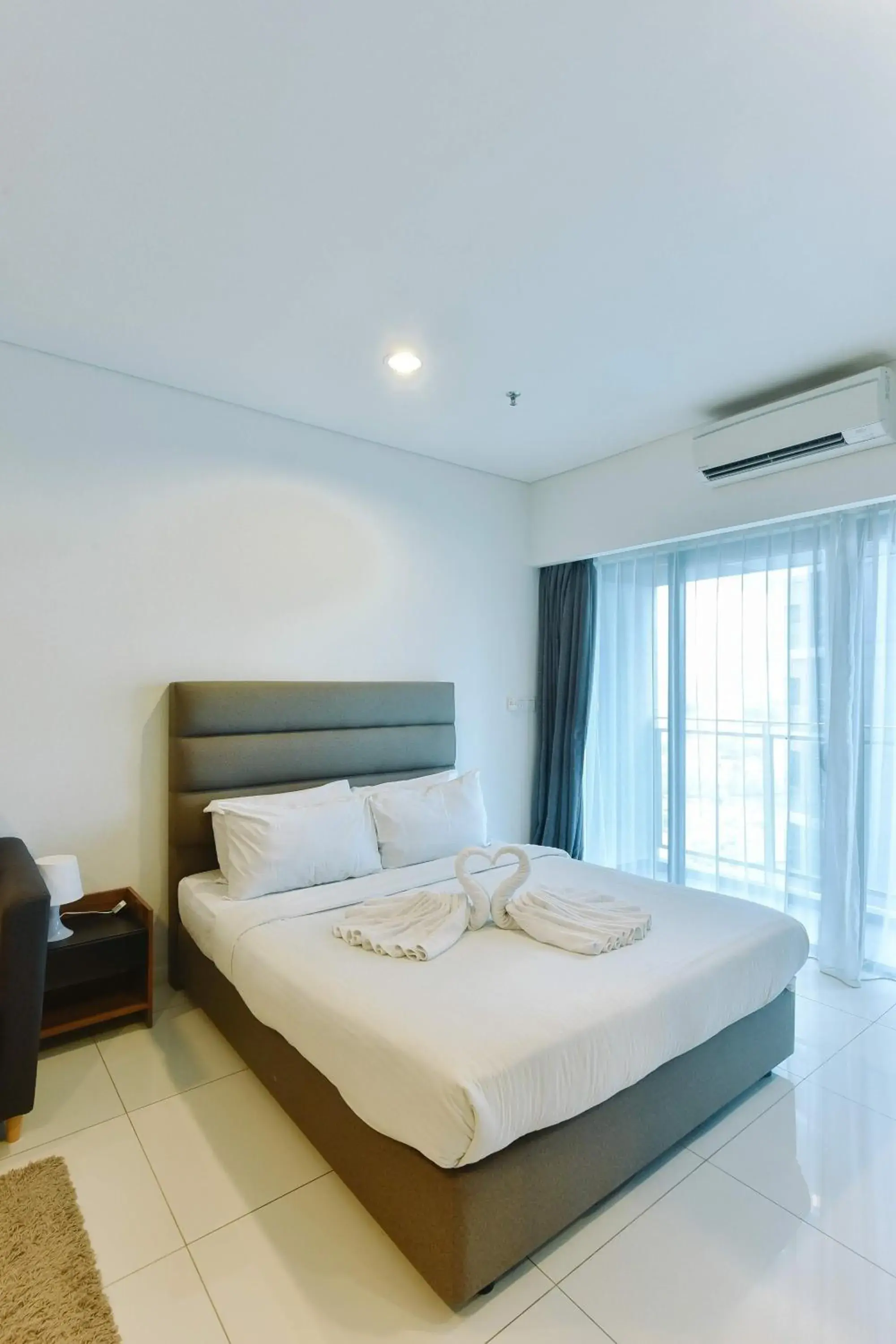 cot, Bed in Summer Suites Residences by Subhome