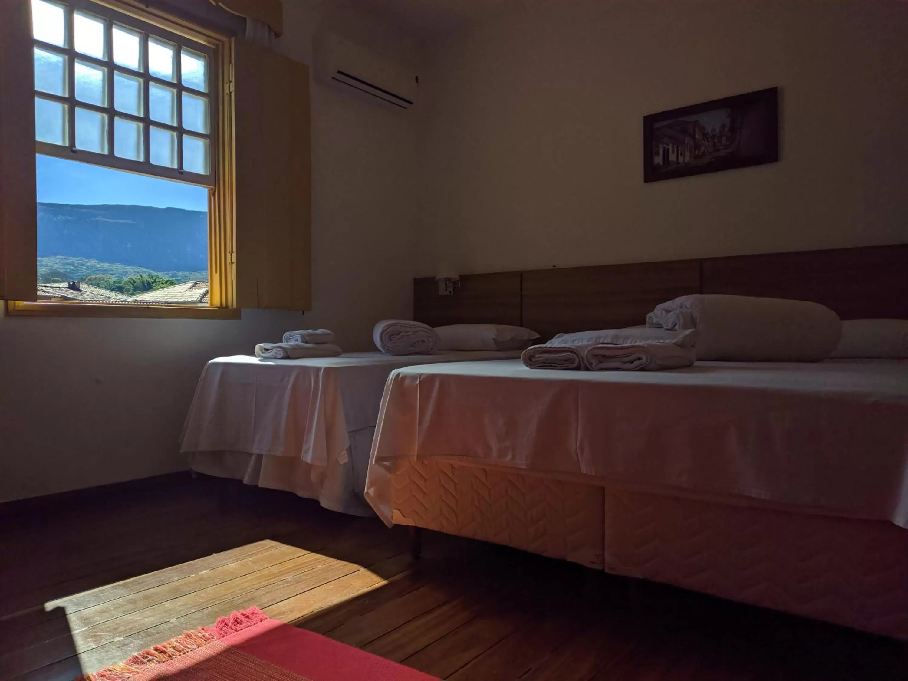 Bed in Pousada o Amanhecer