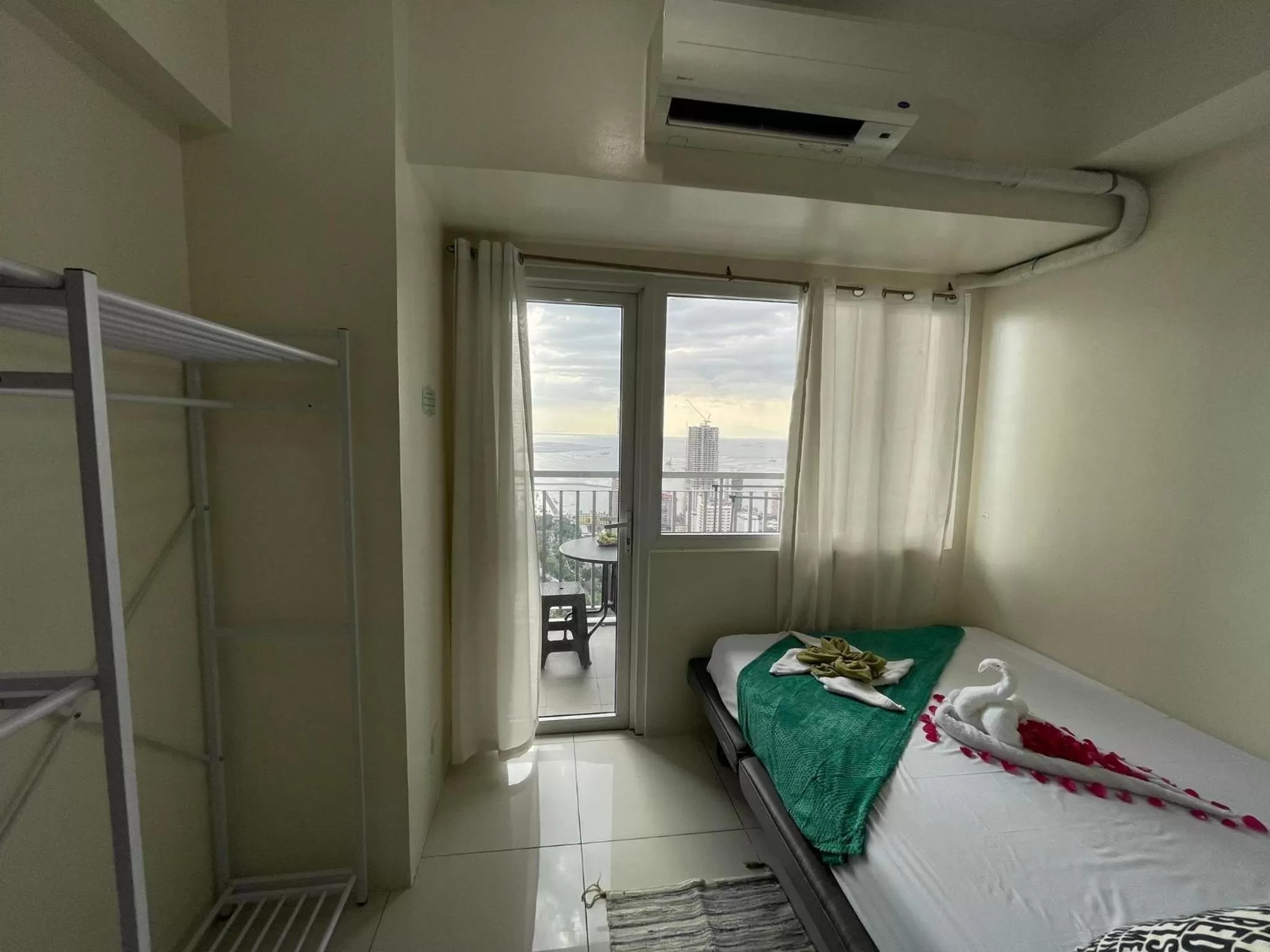 Bed in Green Residences Stays by PBYY