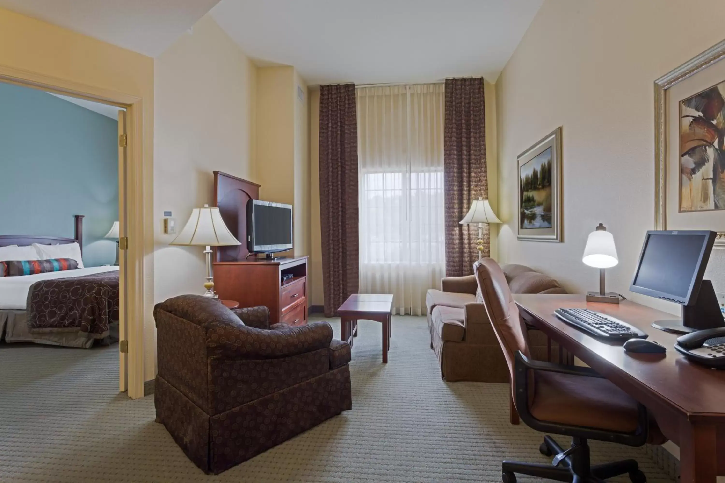 Photo of the whole room, Seating Area in Staybridge Suites Tallahassee I-10 East, an IHG Hotel