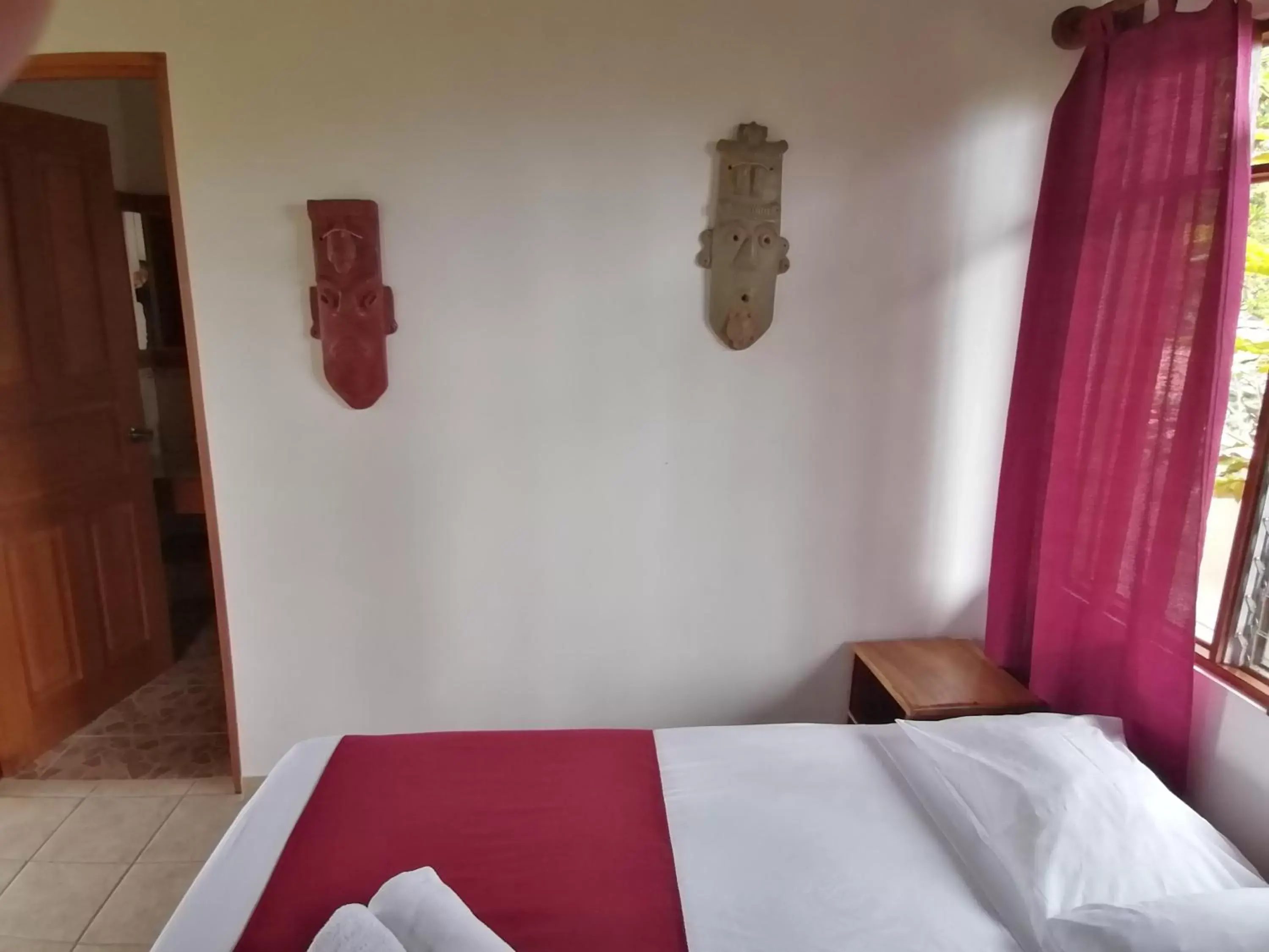 Property building, Bed in La Ceiba Tree Lodge