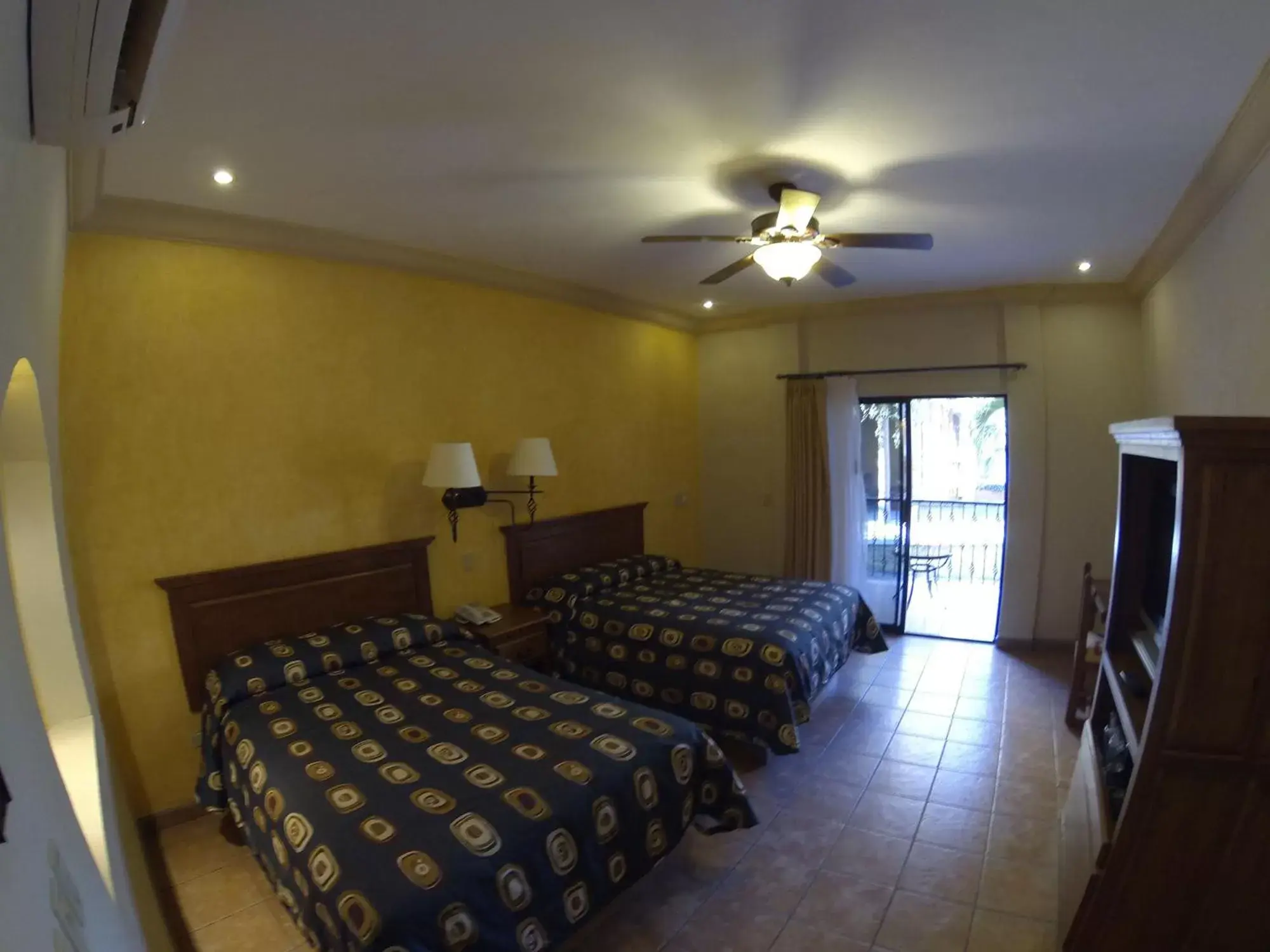 Photo of the whole room, Bed in Hacienda Suites Loreto