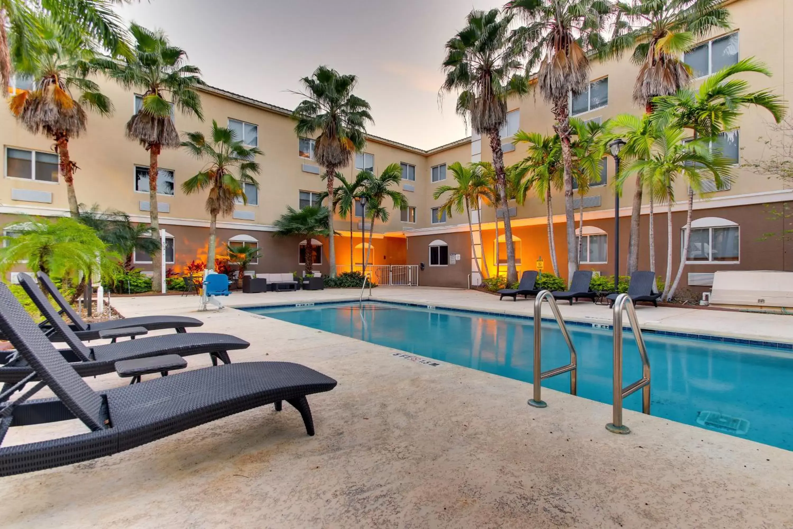 Property building, Swimming Pool in Holiday Inn Express West Palm Beach Metrocentre, an IHG Hotel