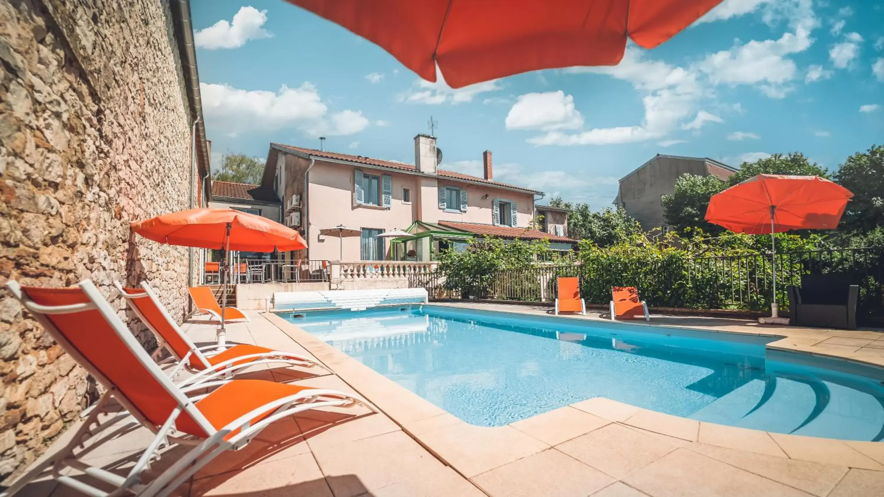 Swimming Pool in Logis Hôtel Restaurant Vuillot