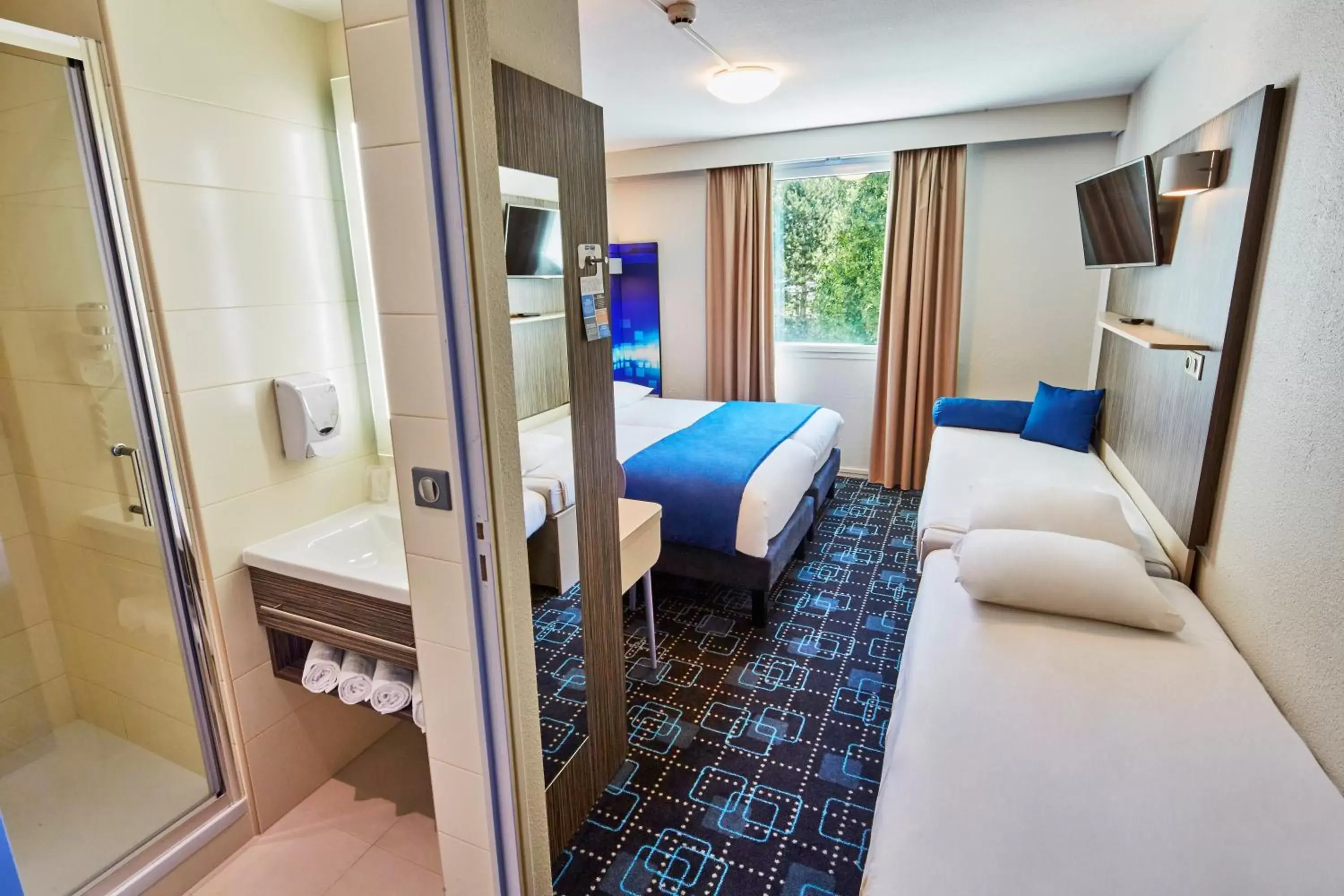 Bed in Kyriad Poitiers Jules Verne Site du Futuroscope Bed in Kyriad Poitiers Jules Verne Site du Futuroscope