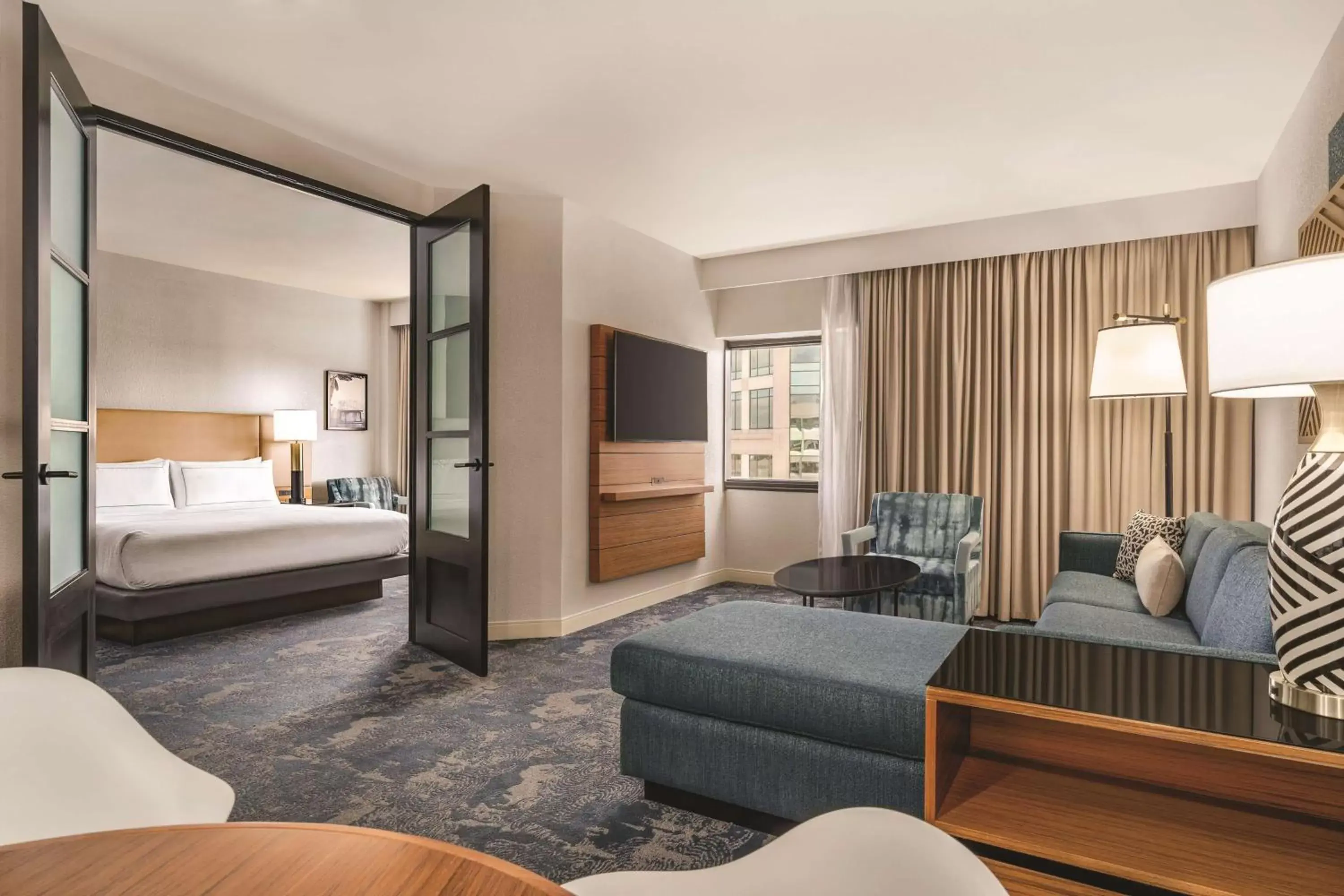 Living room, Bed in DoubleTree by Hilton Tampa Rocky Point Waterfront Living room, Bed in DoubleTree by Hilton Tampa Rocky Point Waterfront