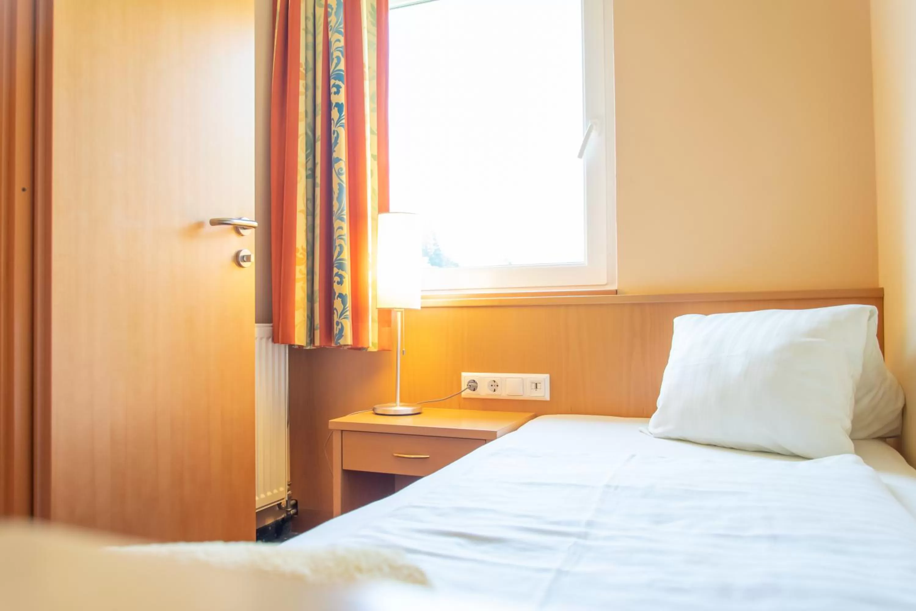 Bed in Strandhotel Burgstaller