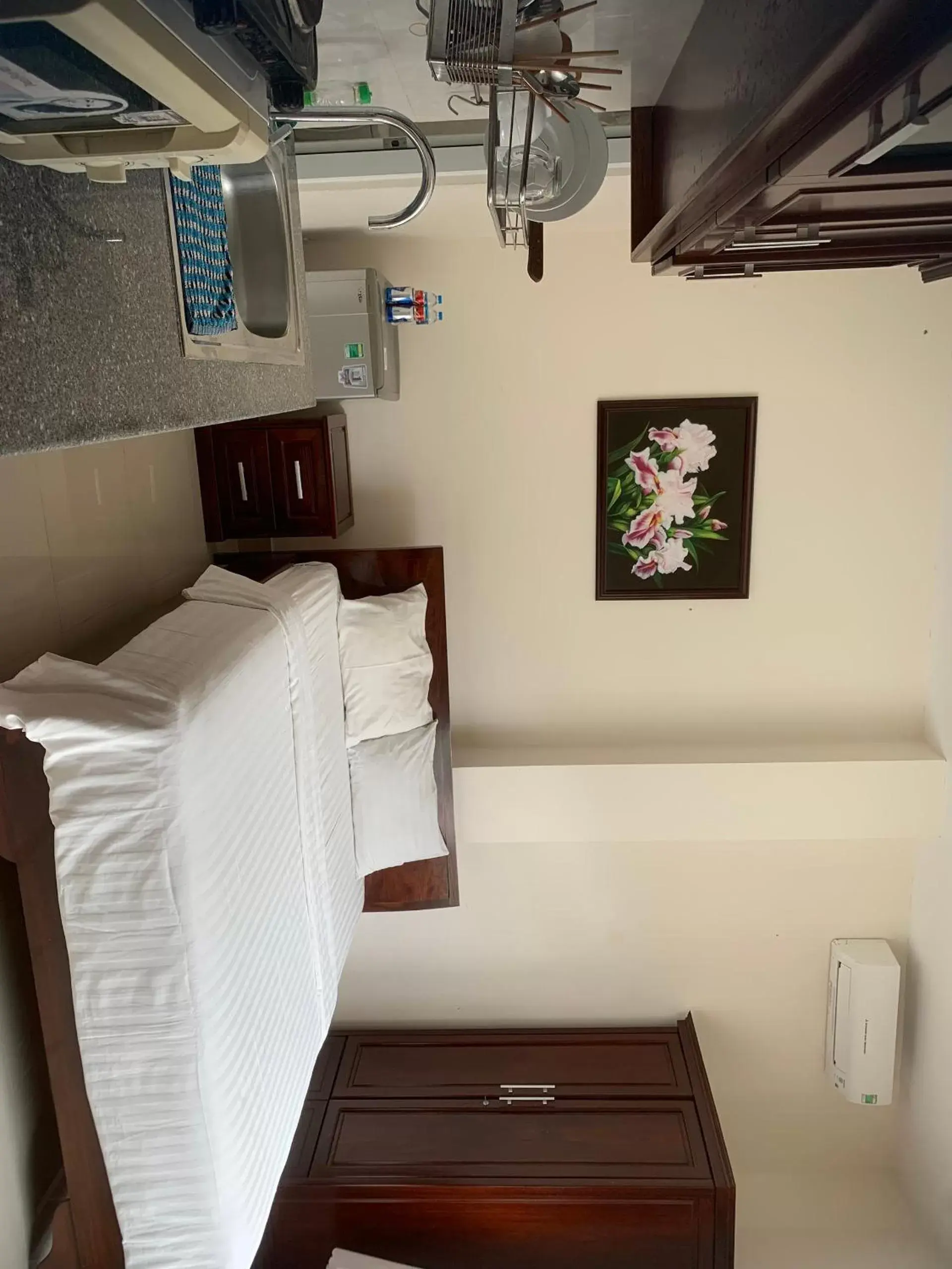Bed in Lotus Apartment Hotel