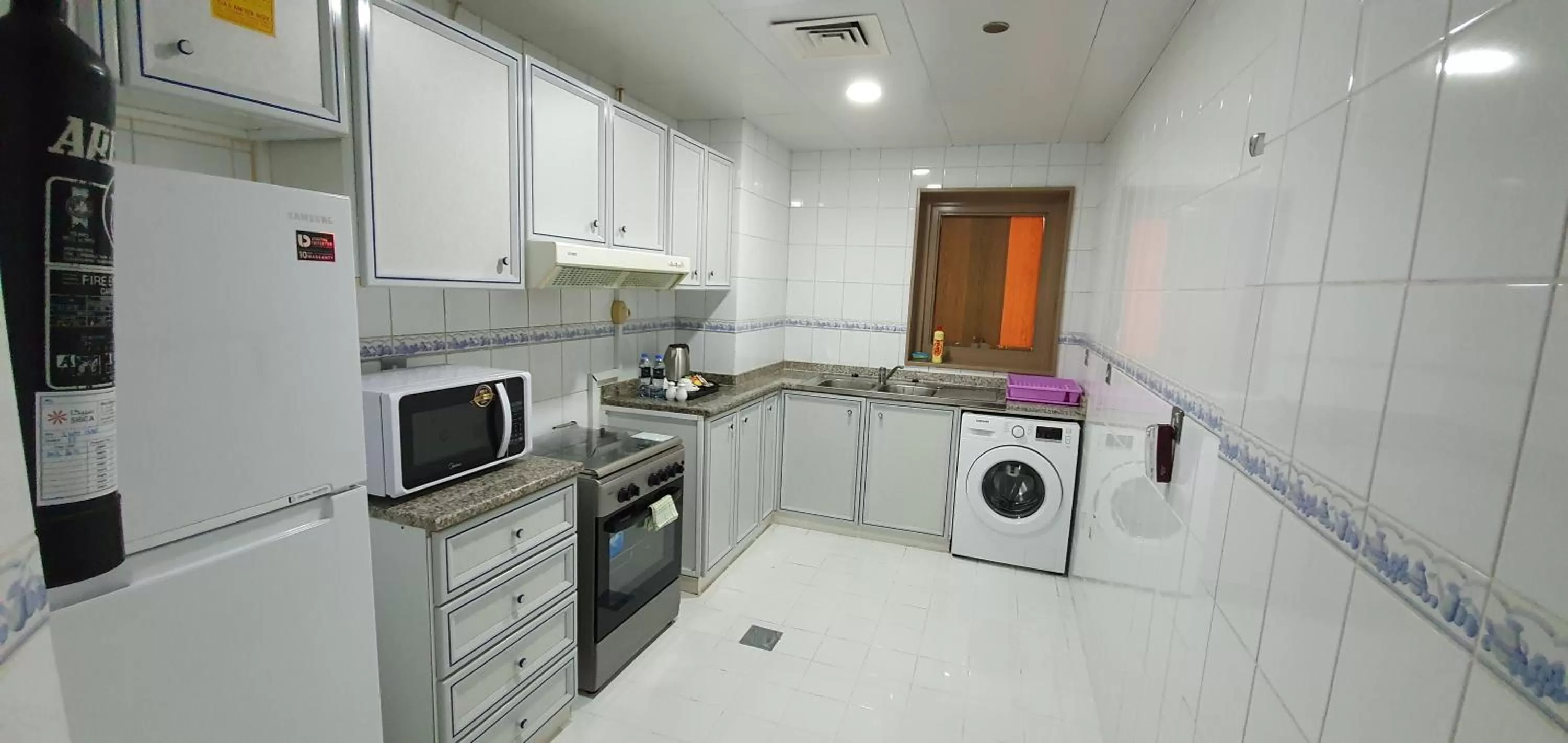 Kitchen or kitchenette in Ivory Hotel Apartments