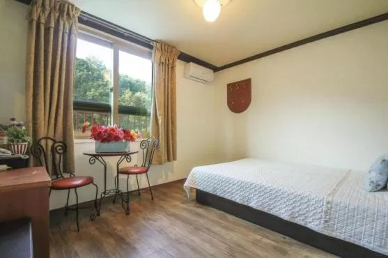 Bed in Saipan Motel with Sea View