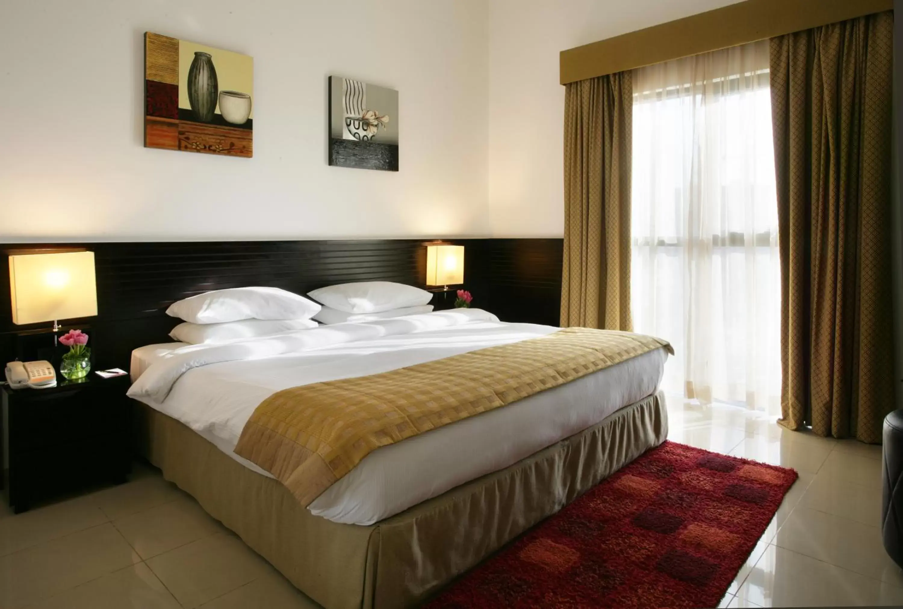 Bed in Ramada Hotel & Suites by Wyndham Ajman