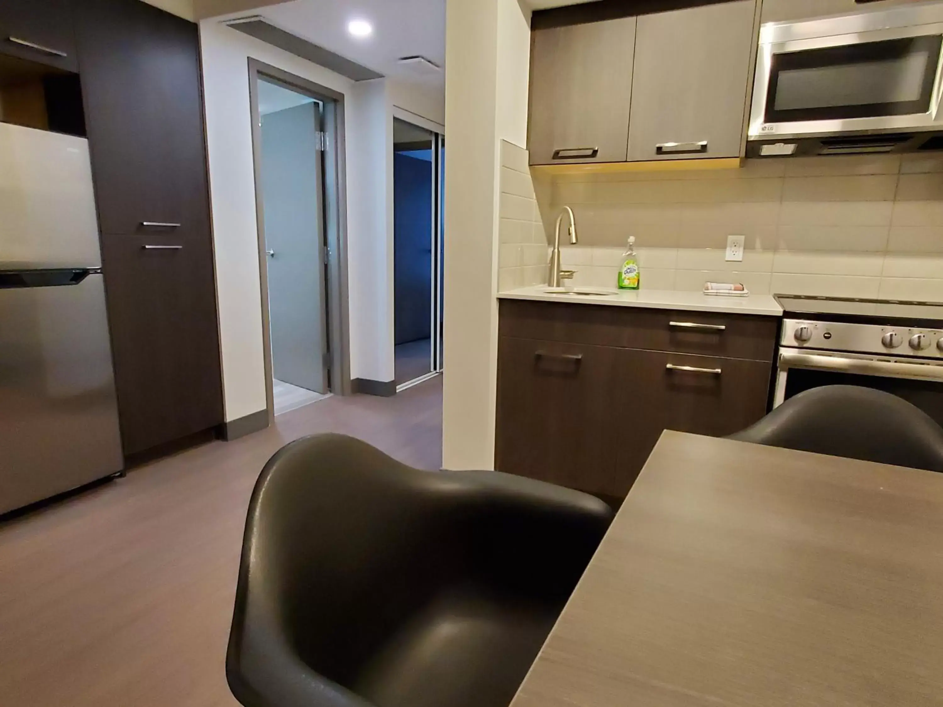 Kitchen or kitchenette, Kitchen/Kitchenette in Super 8 by Wyndham Macleod Trail Calgary