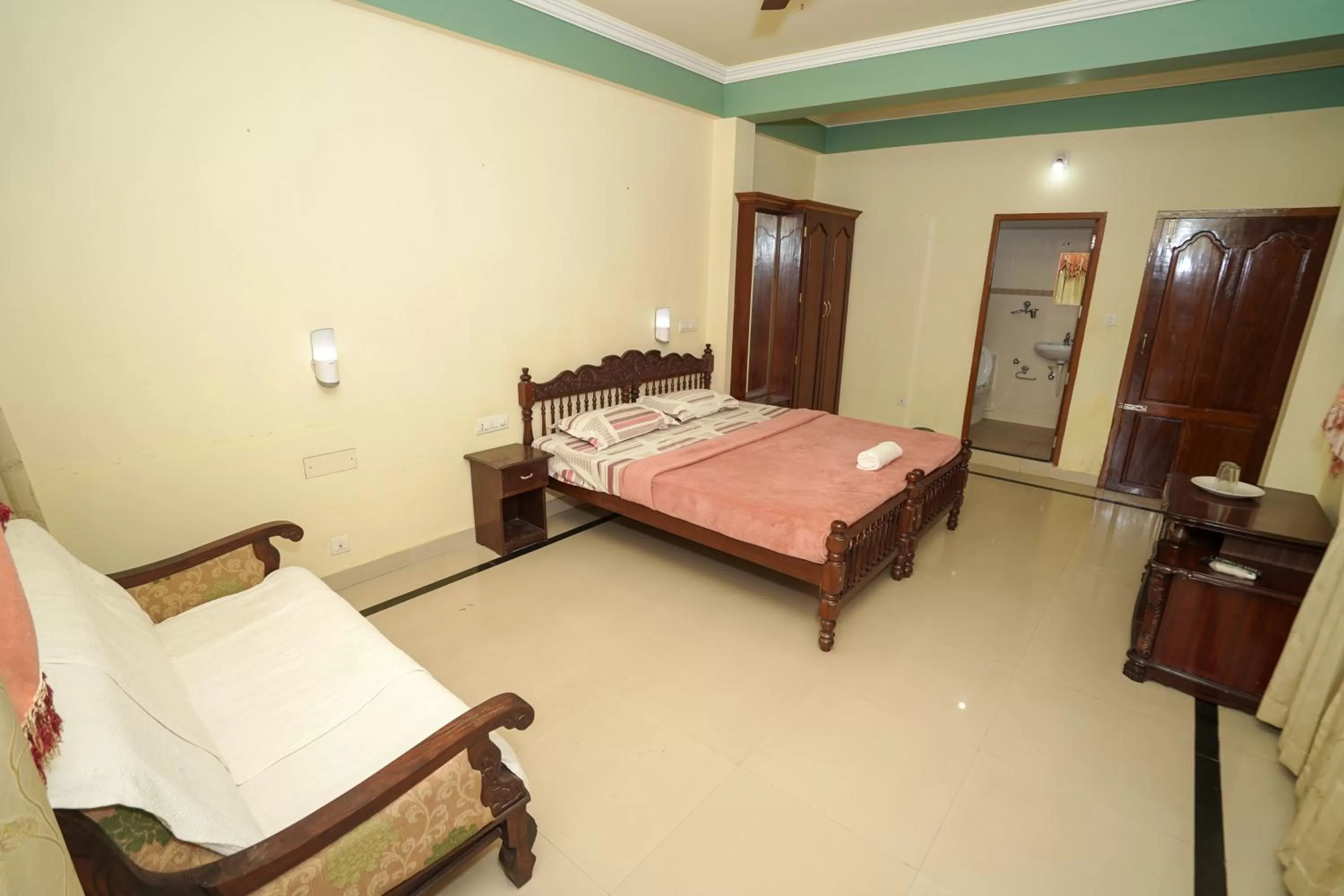 Bed in Sree Mookambika Beach Resort