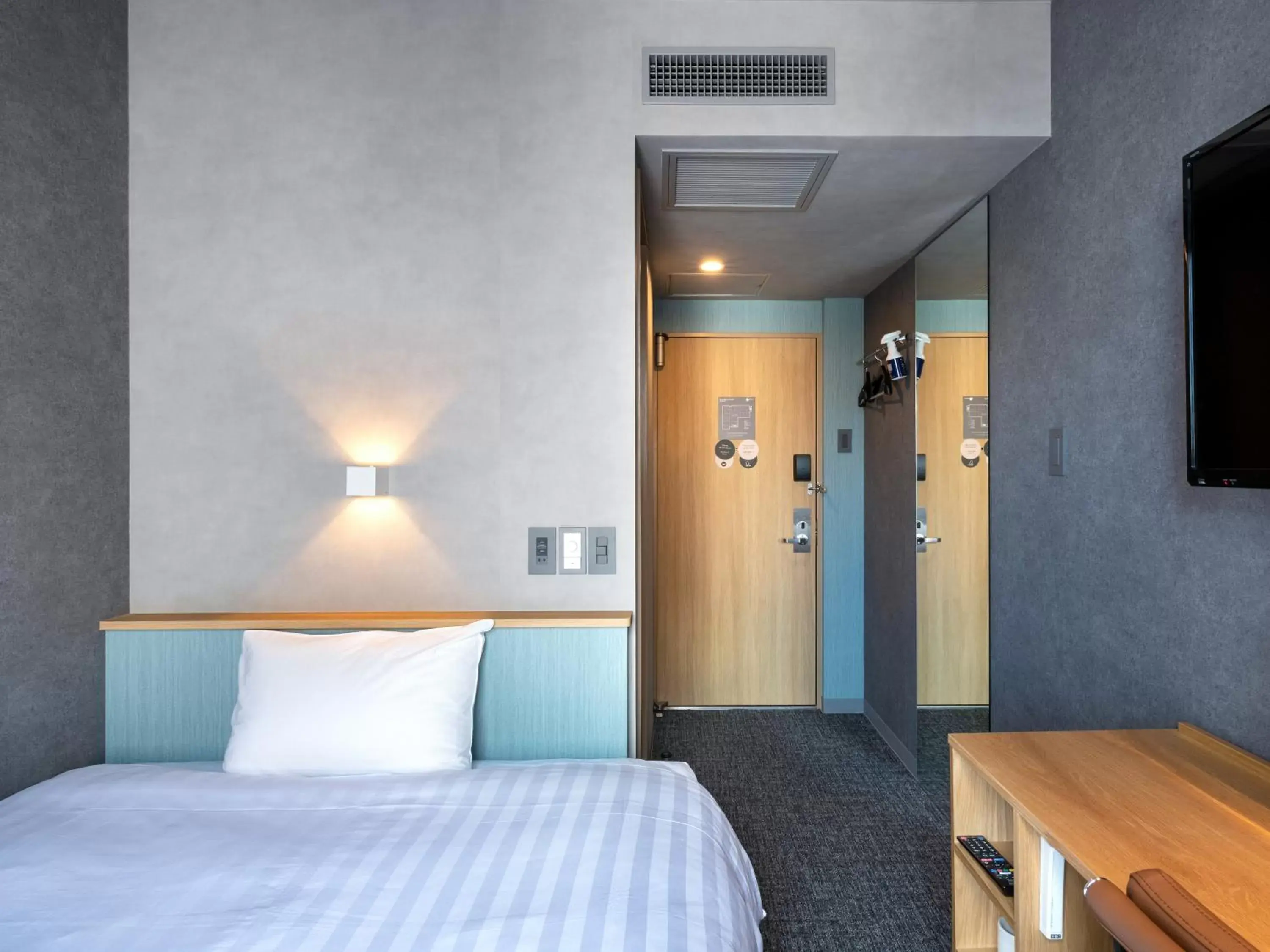 Bed in EN HOTEL Hamamatsu