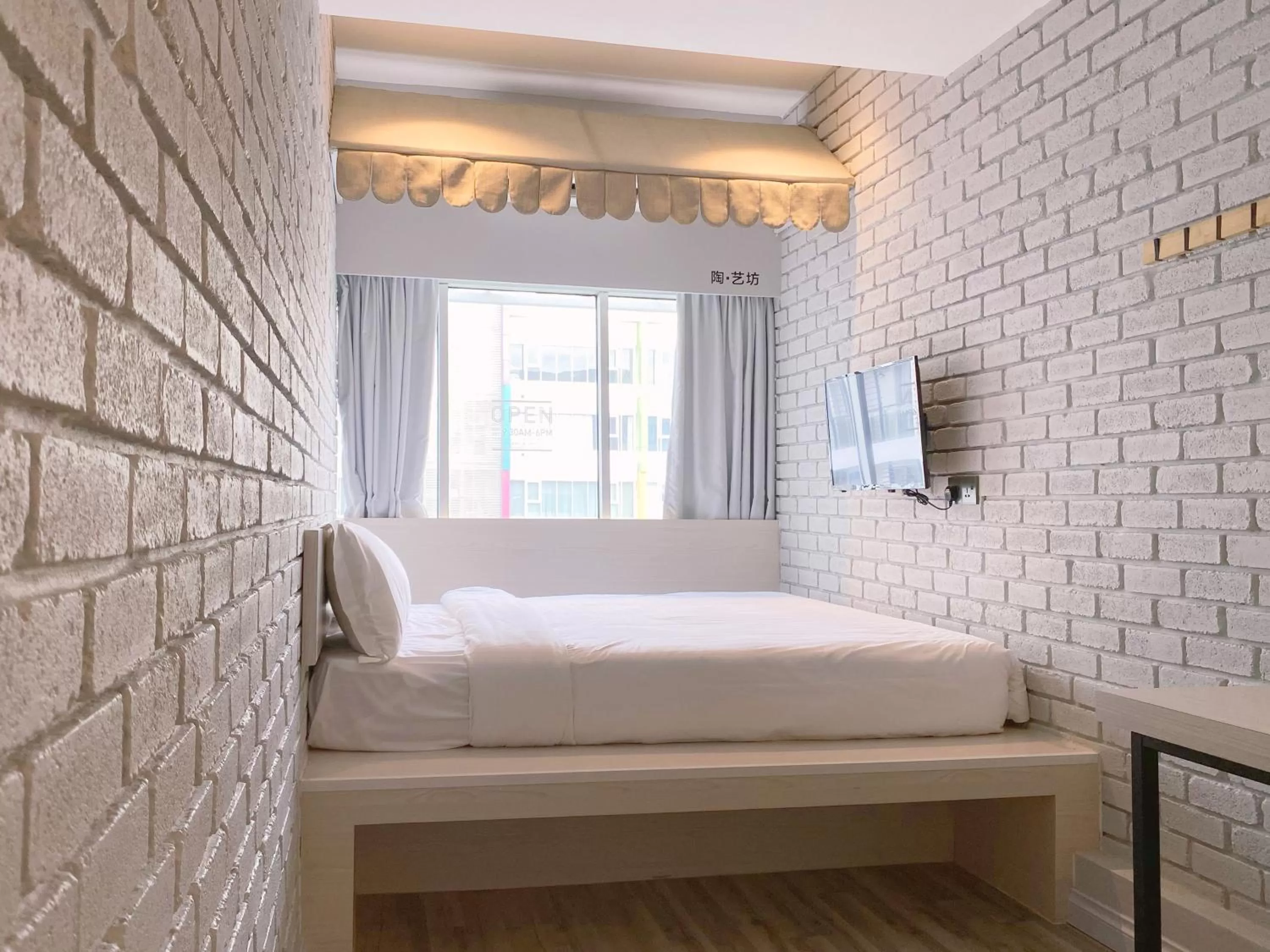 Bed in The Atelier Boutique Hotel