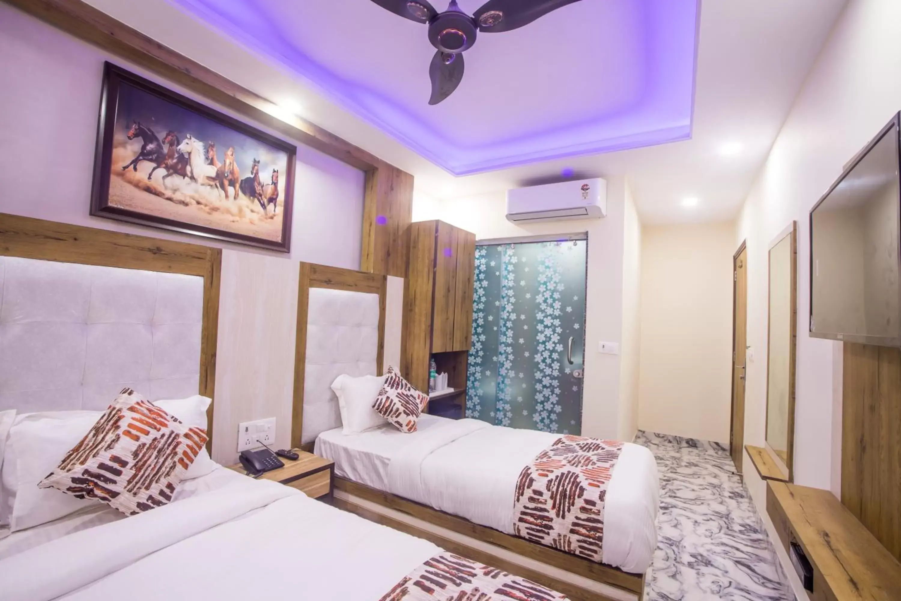 Bed in Hotel Harsha International