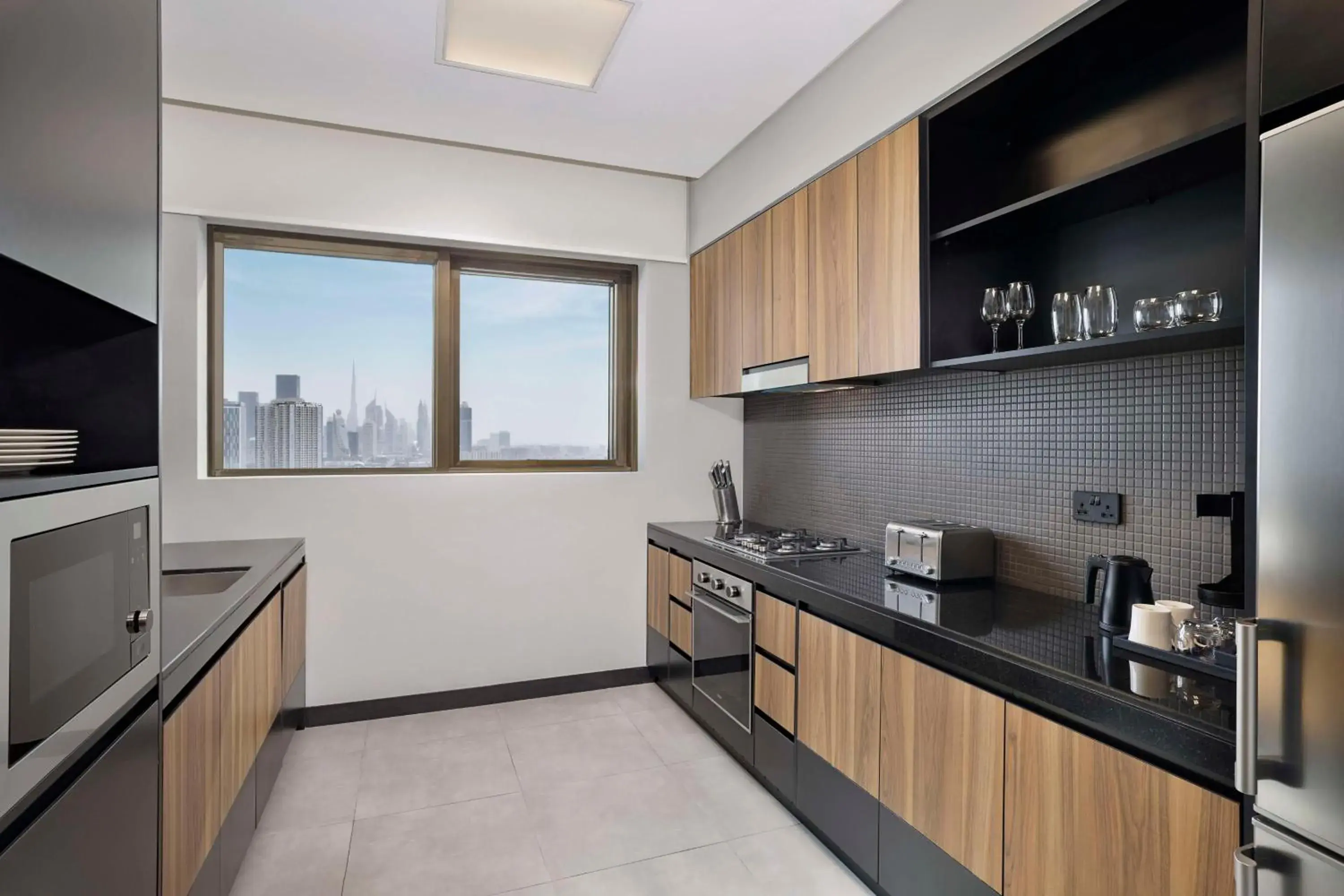 View (from property/room), Kitchen/Kitchenette in DoubleTree by Hilton Dubai M Square Hotel & Residences