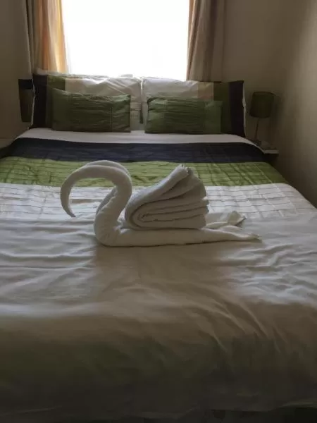 Bed in Admiral Guest House