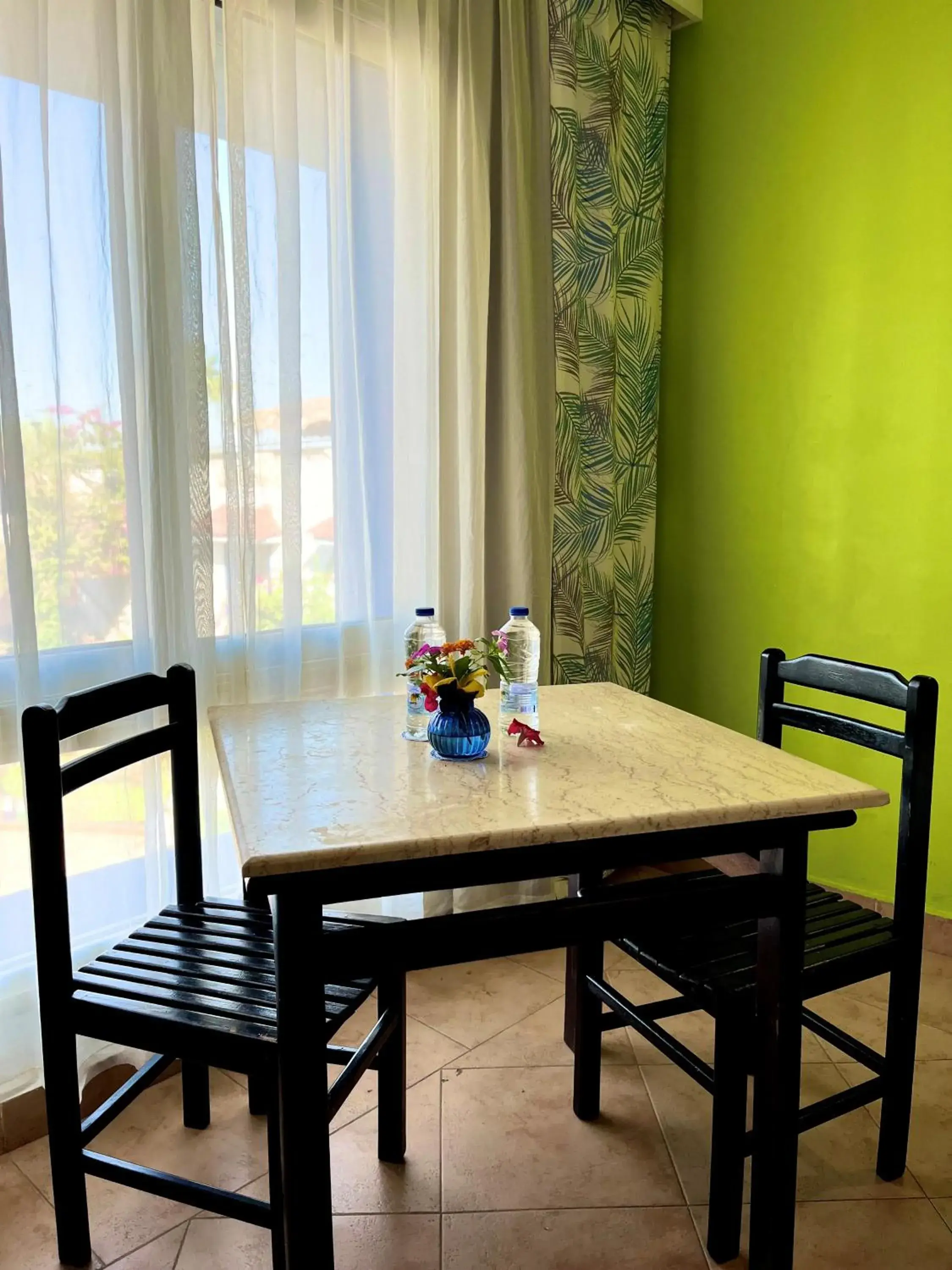 Bedroom, Dining Area in Naama Blue Hotel