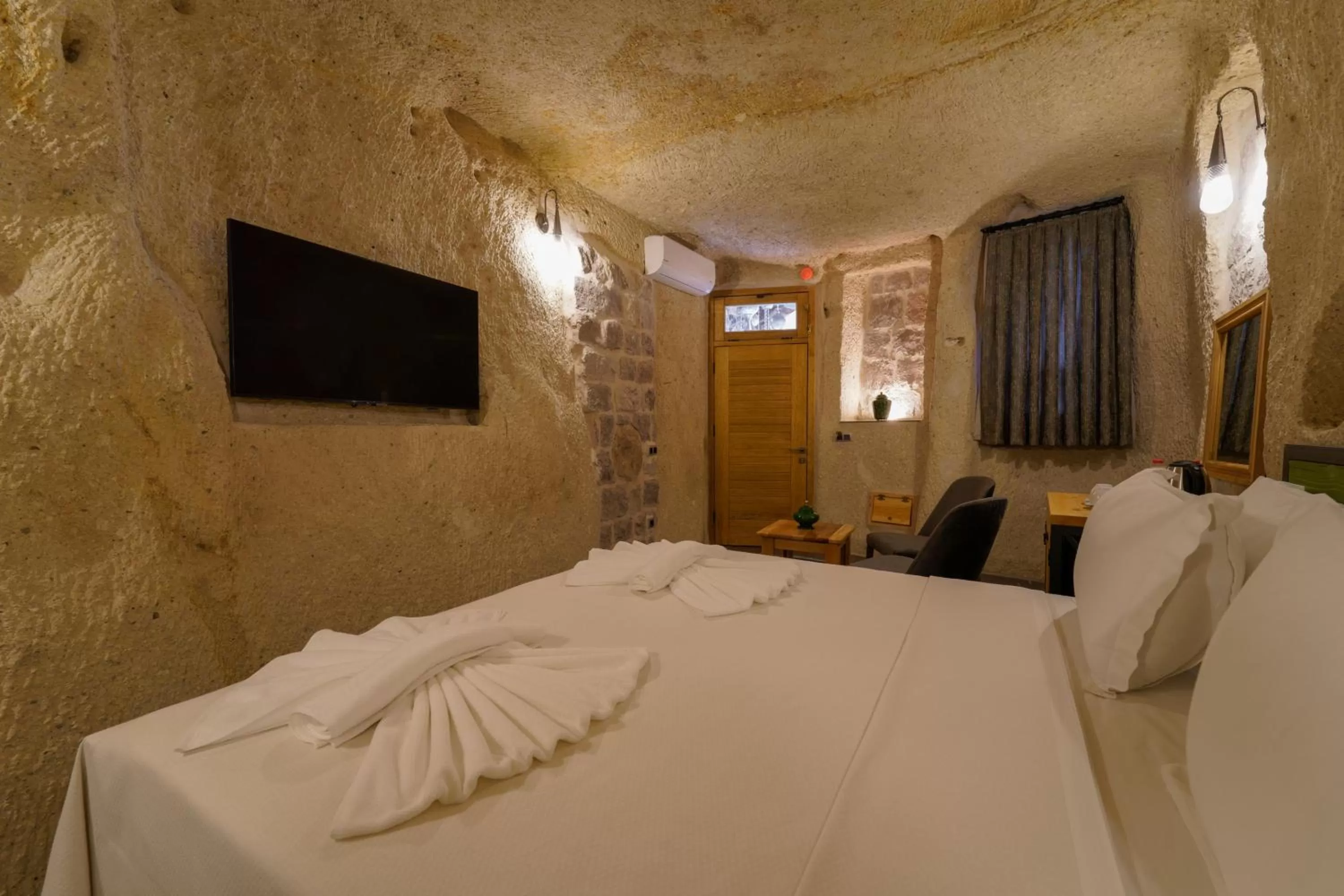 Bed in The Niche Cave Hotel