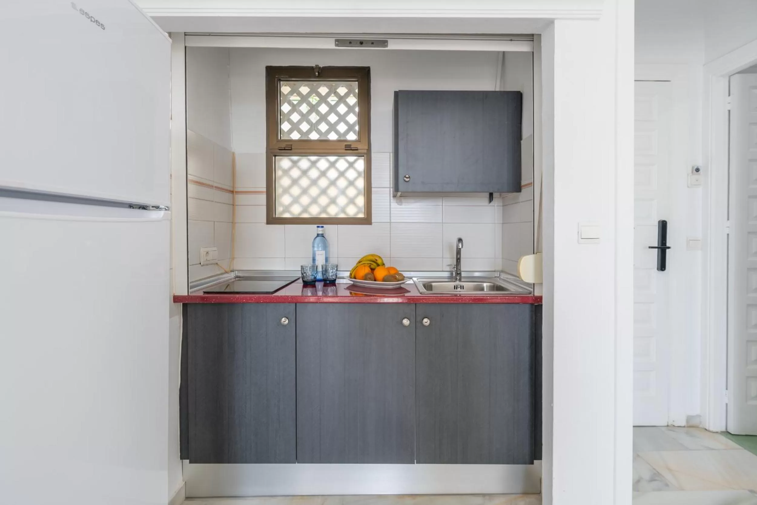 kitchen in Apartahotel Playamaro by Dorobe