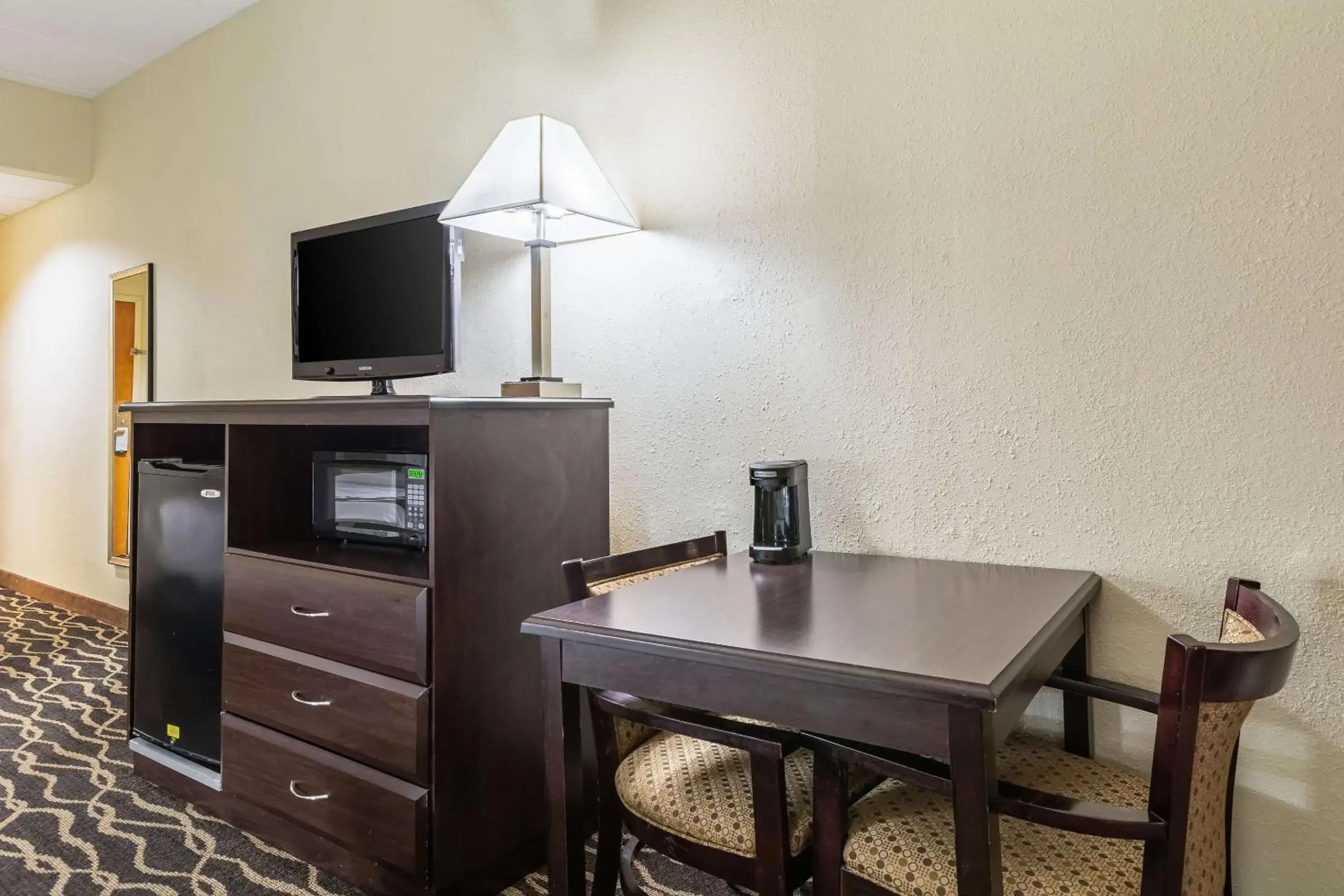 Photo of the whole room, TV/Entertainment Center in Quality Inn & Suites Southport
