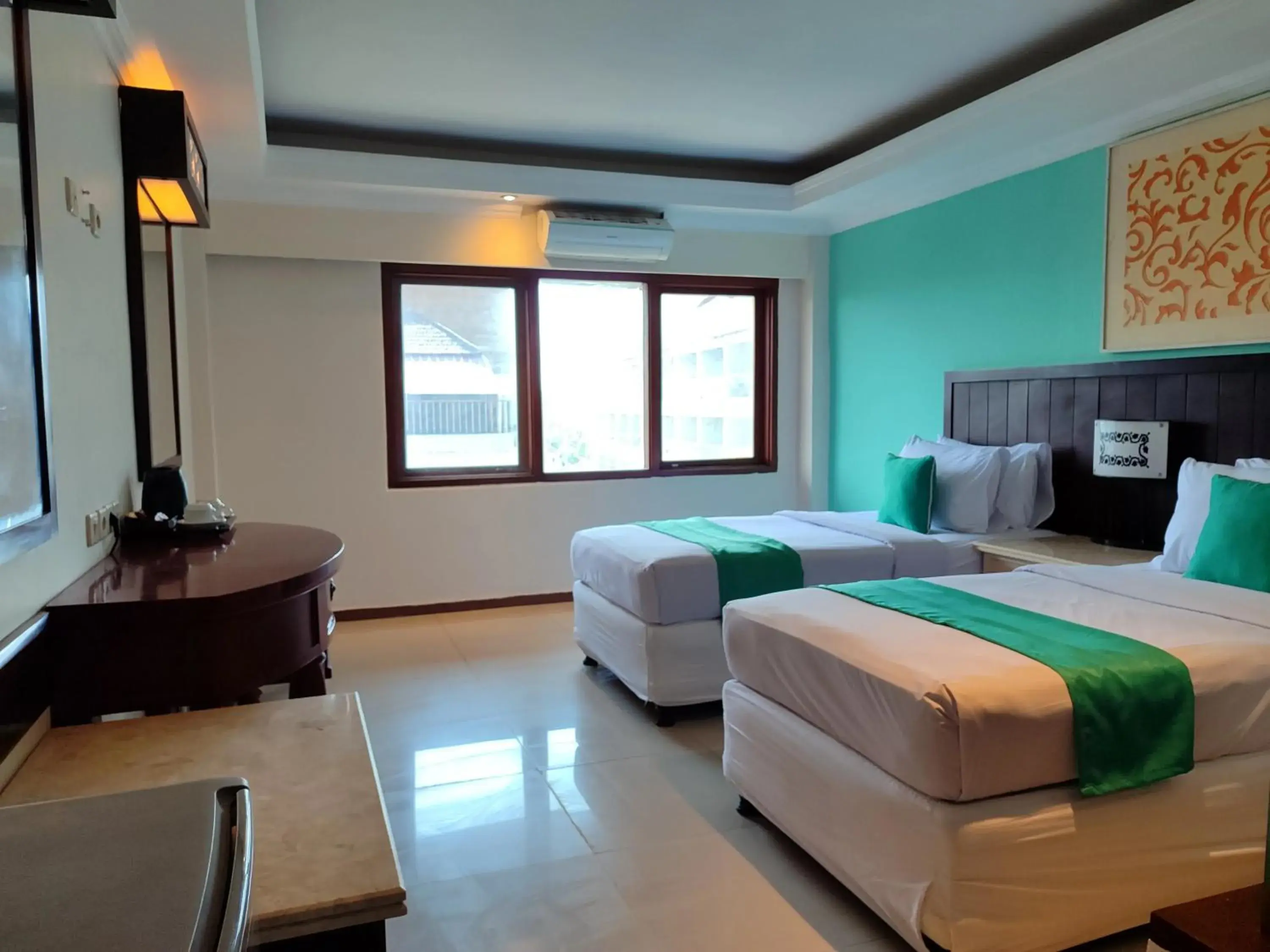 Bed in Maharani Beach Hotel