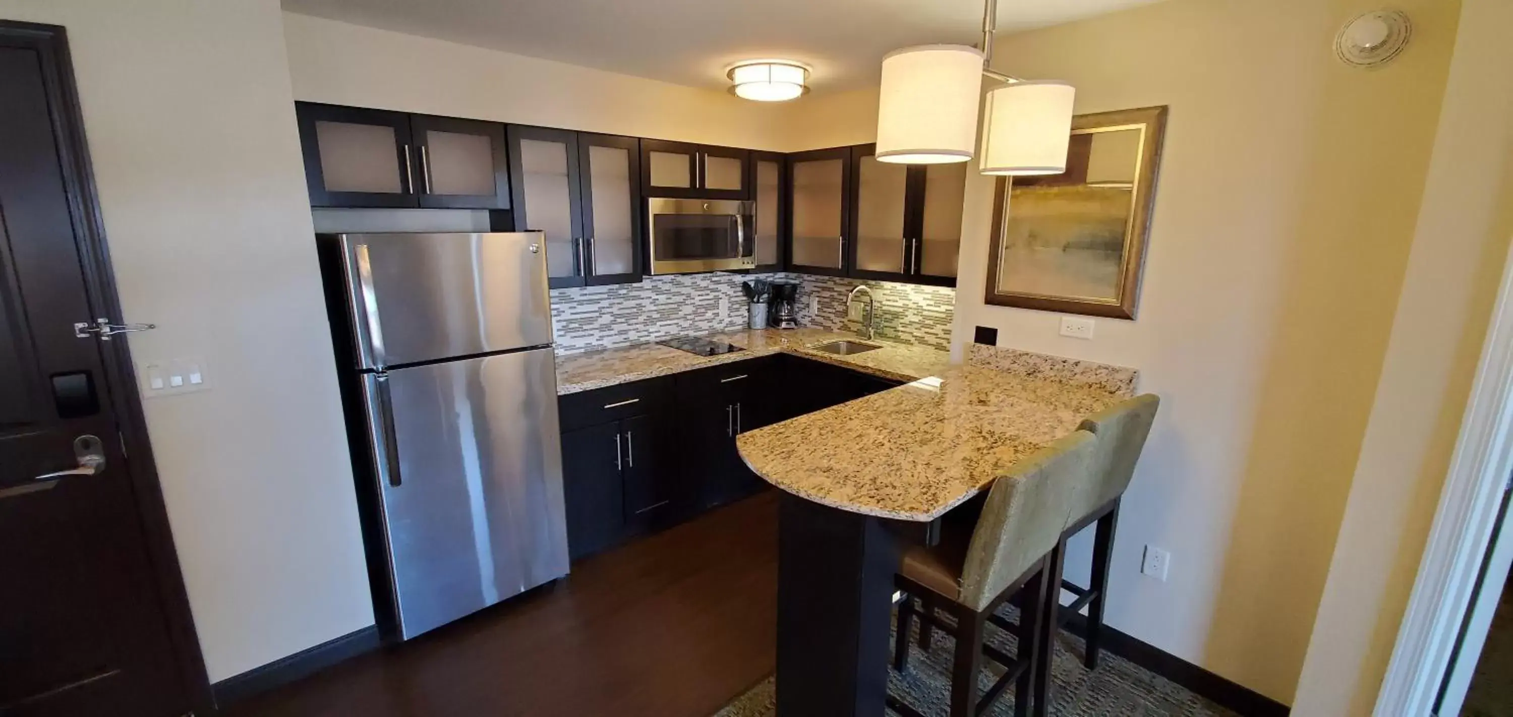 Photo of the whole room, Kitchen/Kitchenette in Staybridge Suites Eau Claire - Altoona, an IHG Hotel