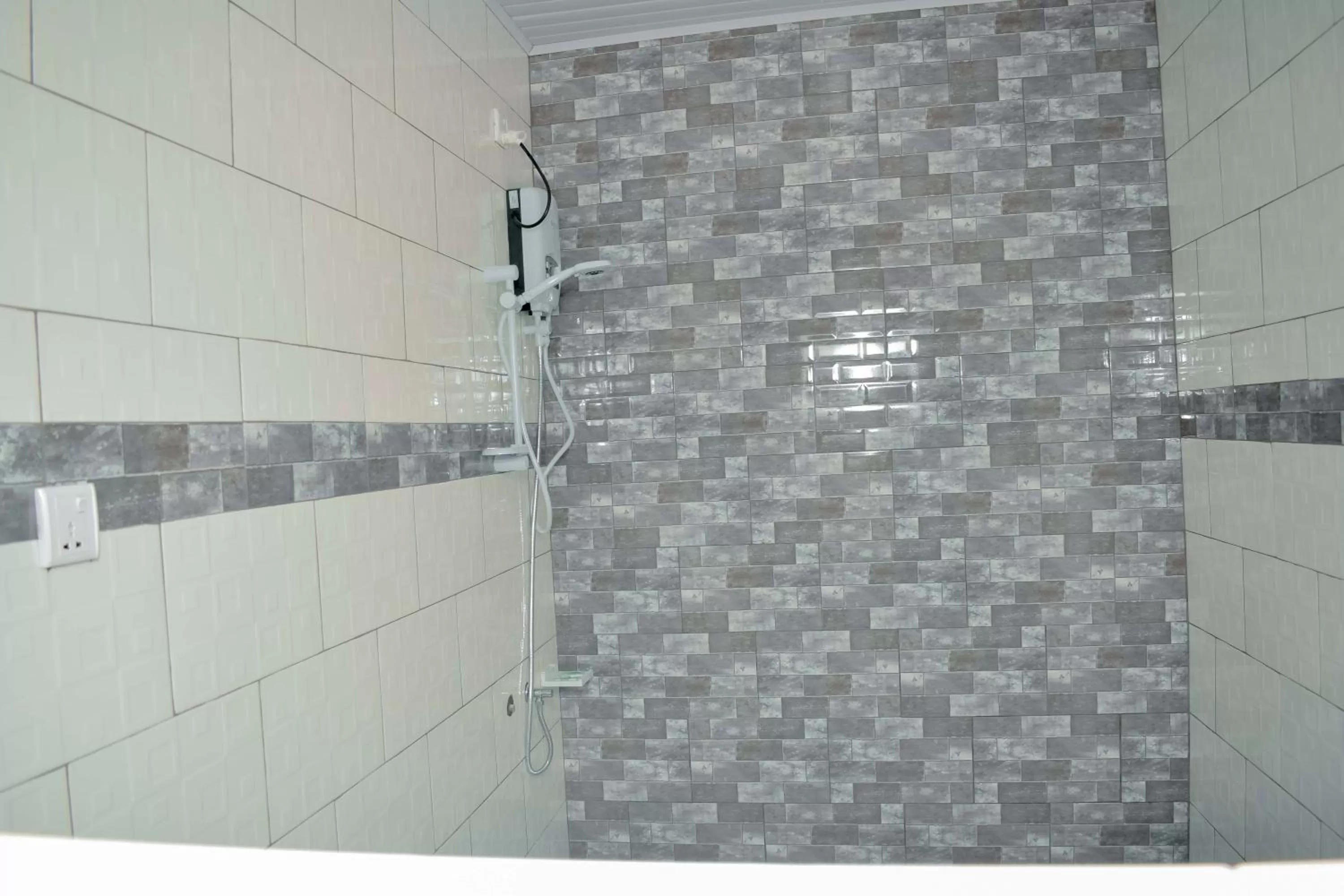 Shower in INZOZI AFRICA HOUSE B&B-Gishushu