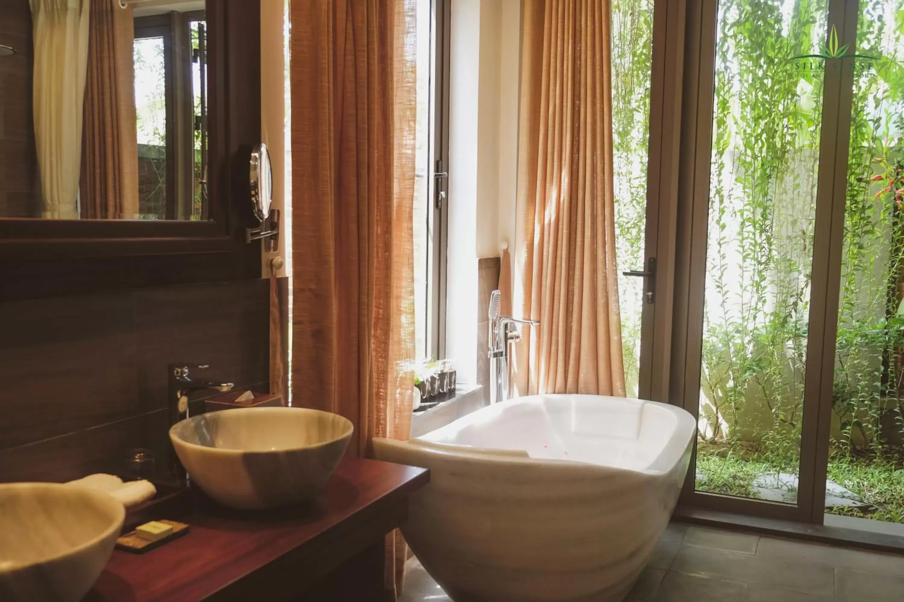 Bathroom in Silk Sense Hoi An River Resort