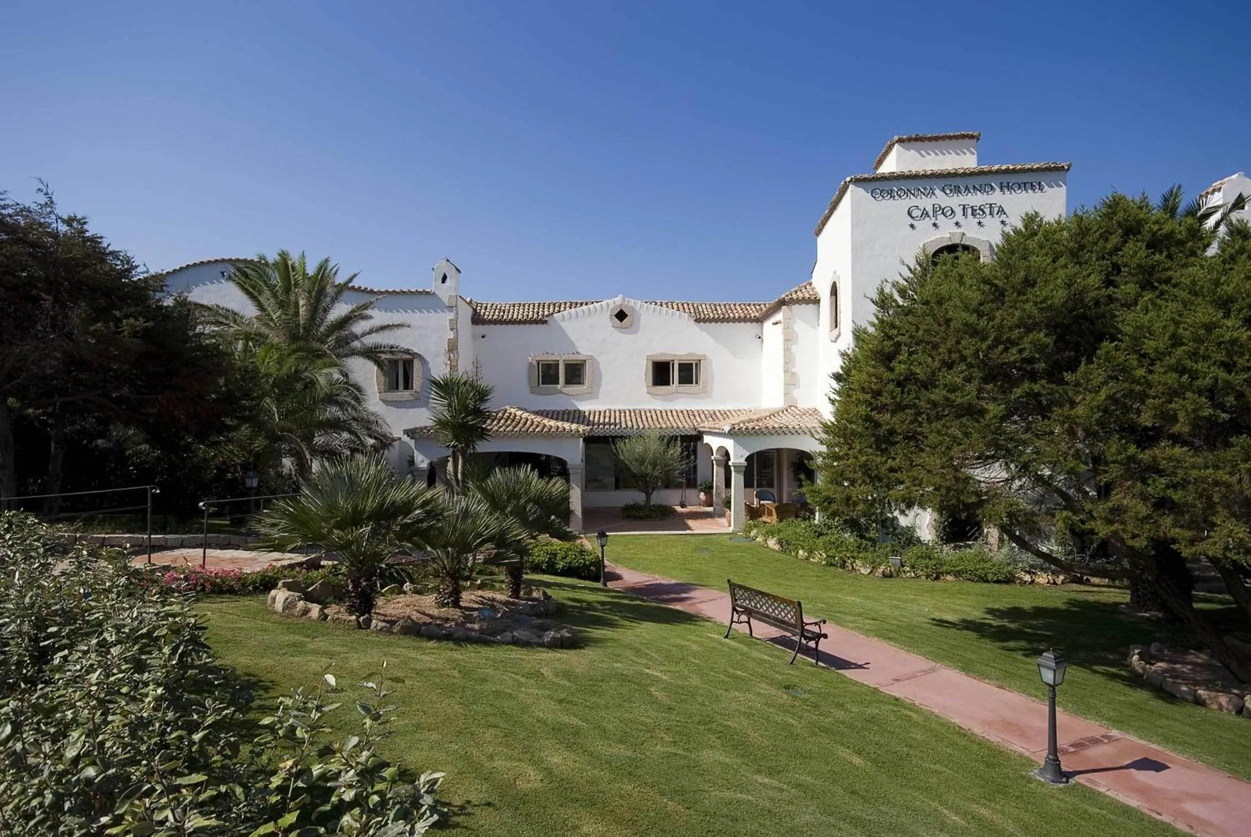 Property building in COLONNA GRAND HOTEL CAPO TESTA, a Colonna Luxury Beach Hotel, Santa Teresa Sardegna