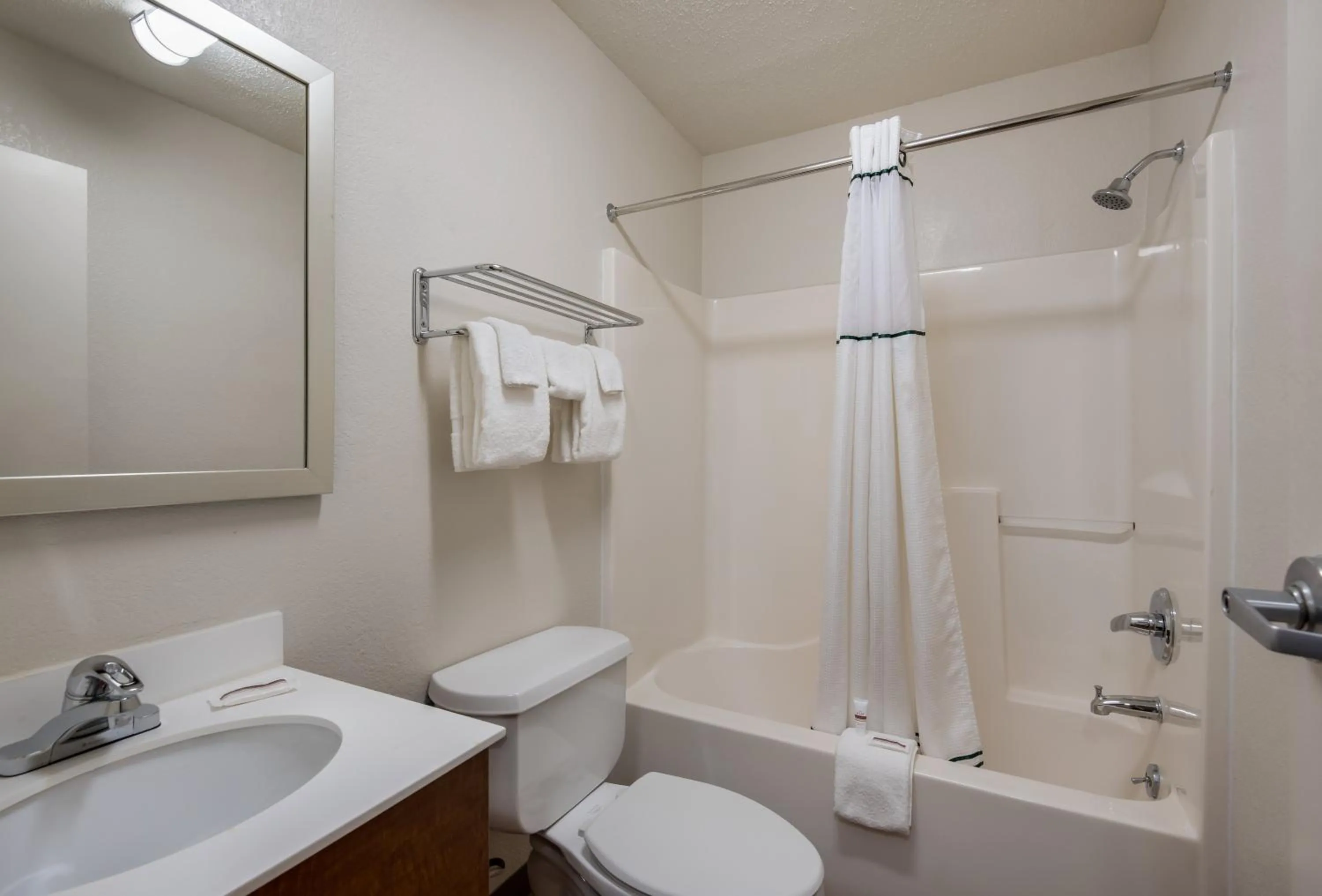 Bathroom in HomeTowne Studios by Red Roof Kansas City - Independence