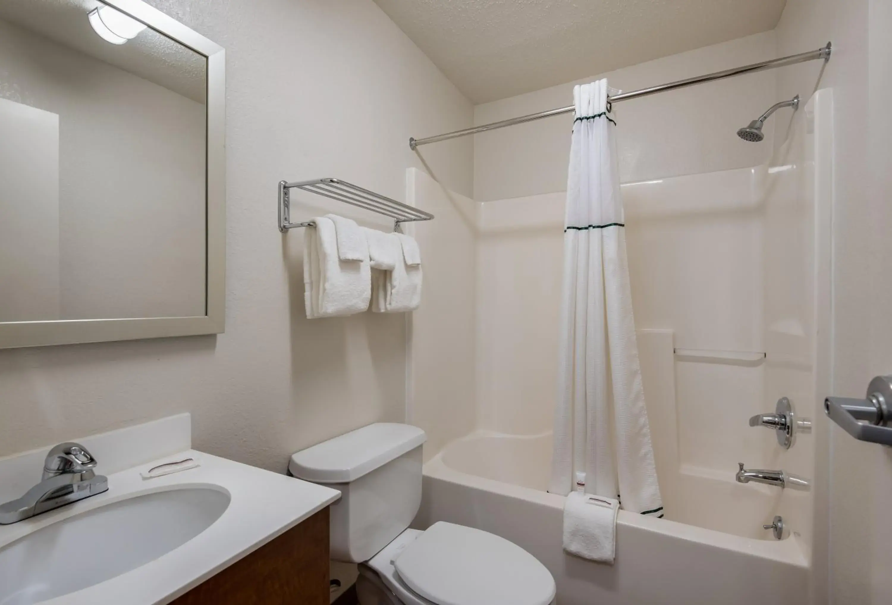 Bathroom in HomeTowne Studios by Red Roof Kansas City - Independence