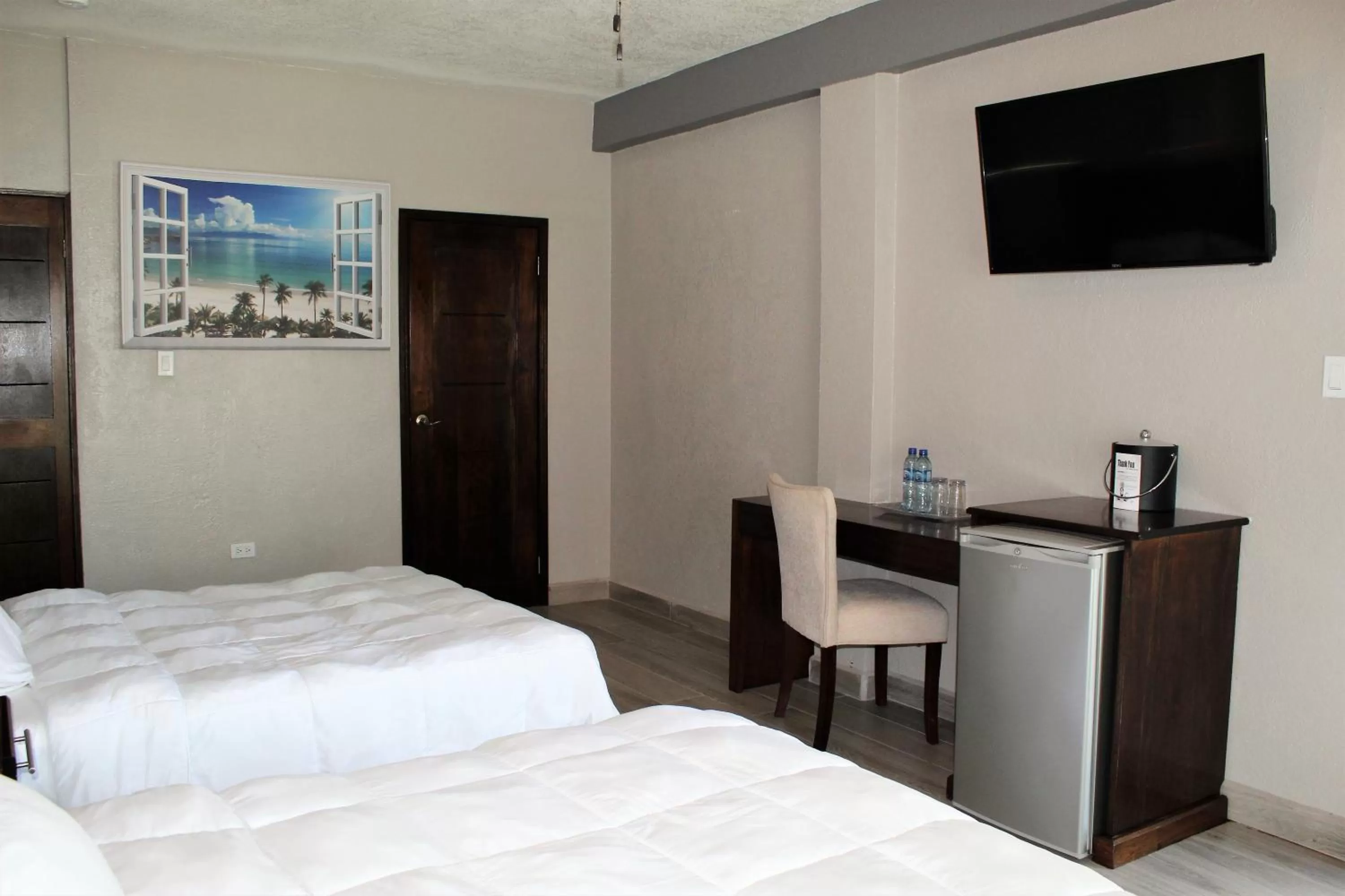 Bed in Barefoot Caye Caulker Hotel