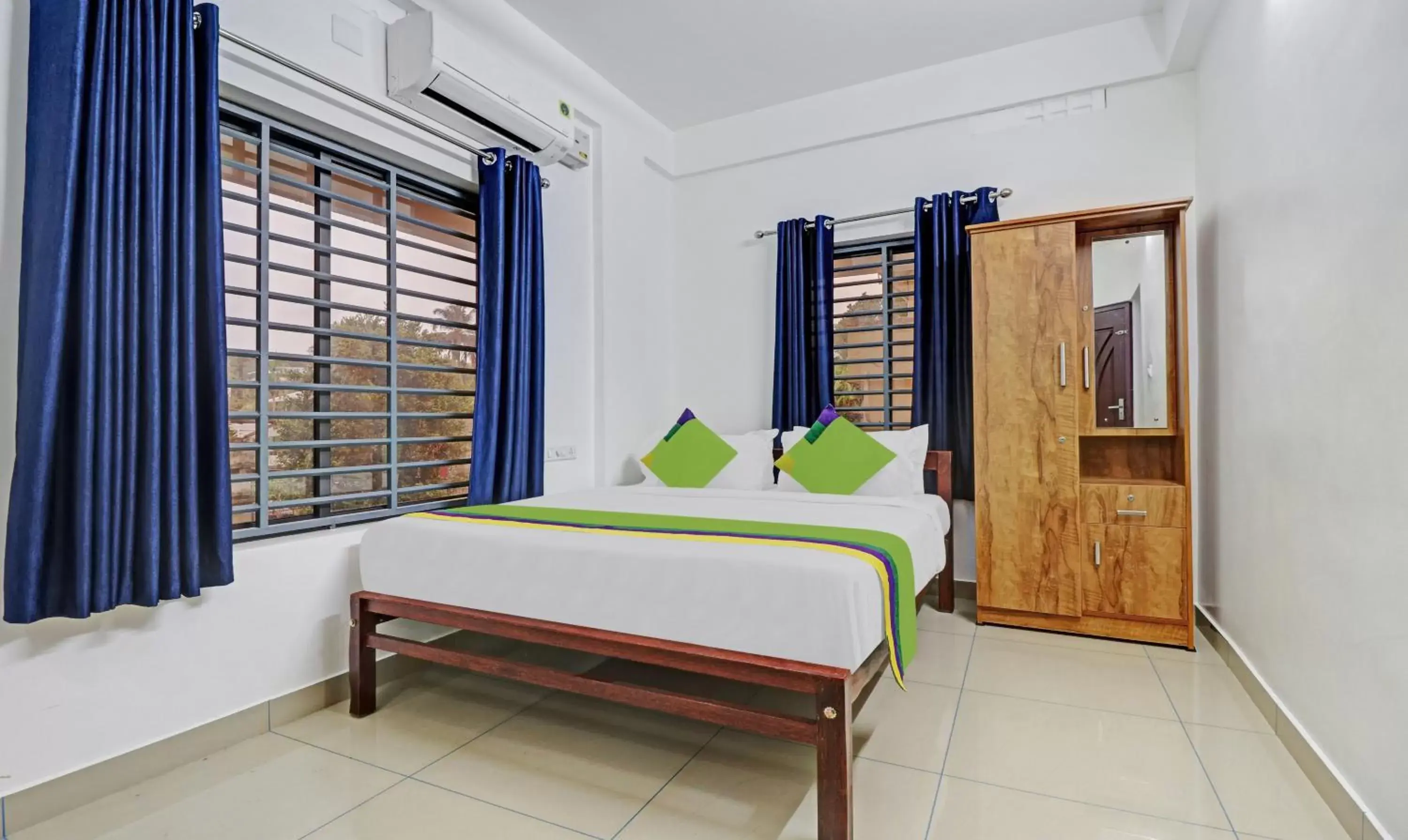 Bedroom, Bed in Treebo Trend Nirupama Apartment