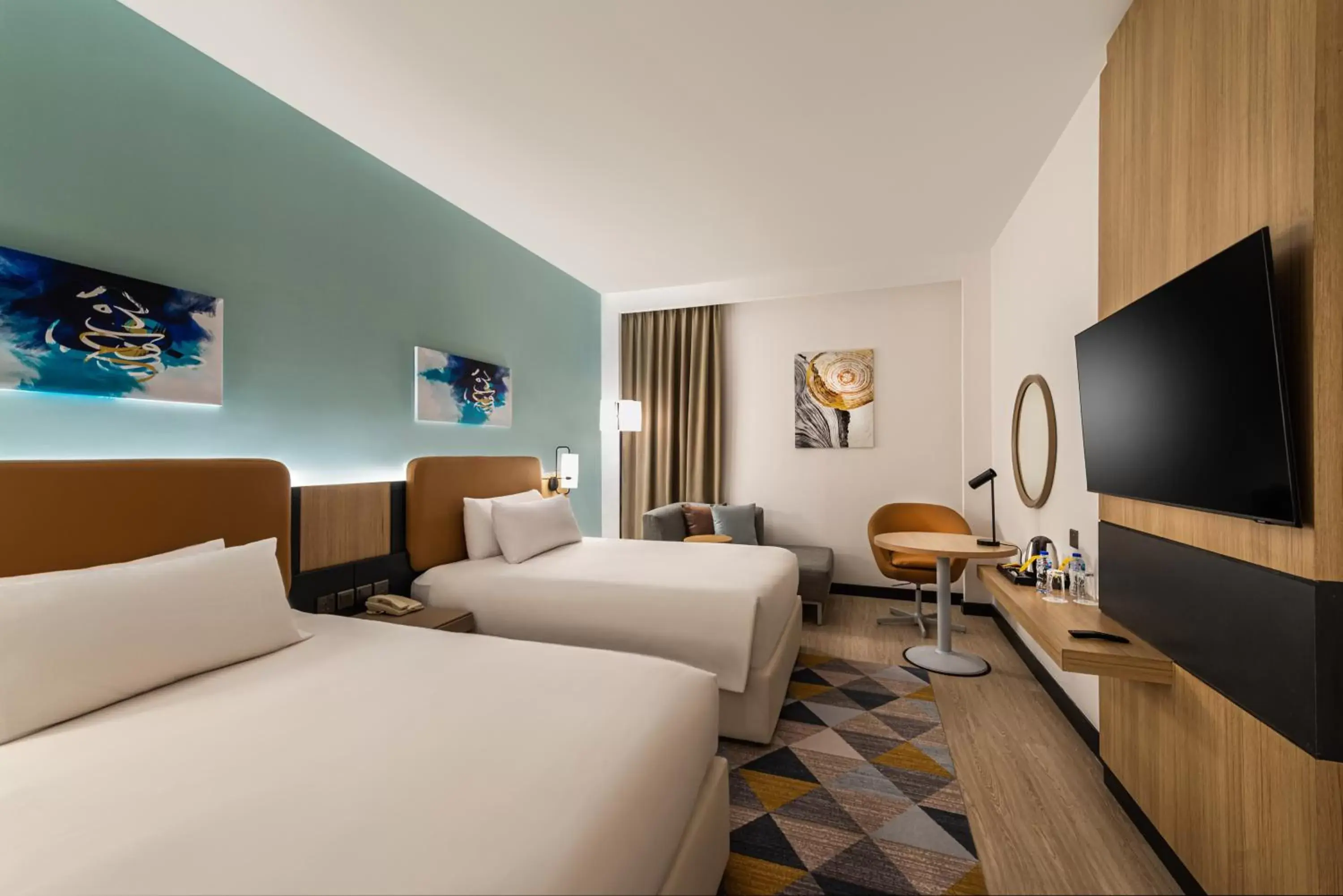 Bed, TV/Entertainment Center in Holiday Inn Riyadh Al Qasr, an IHG Hotel