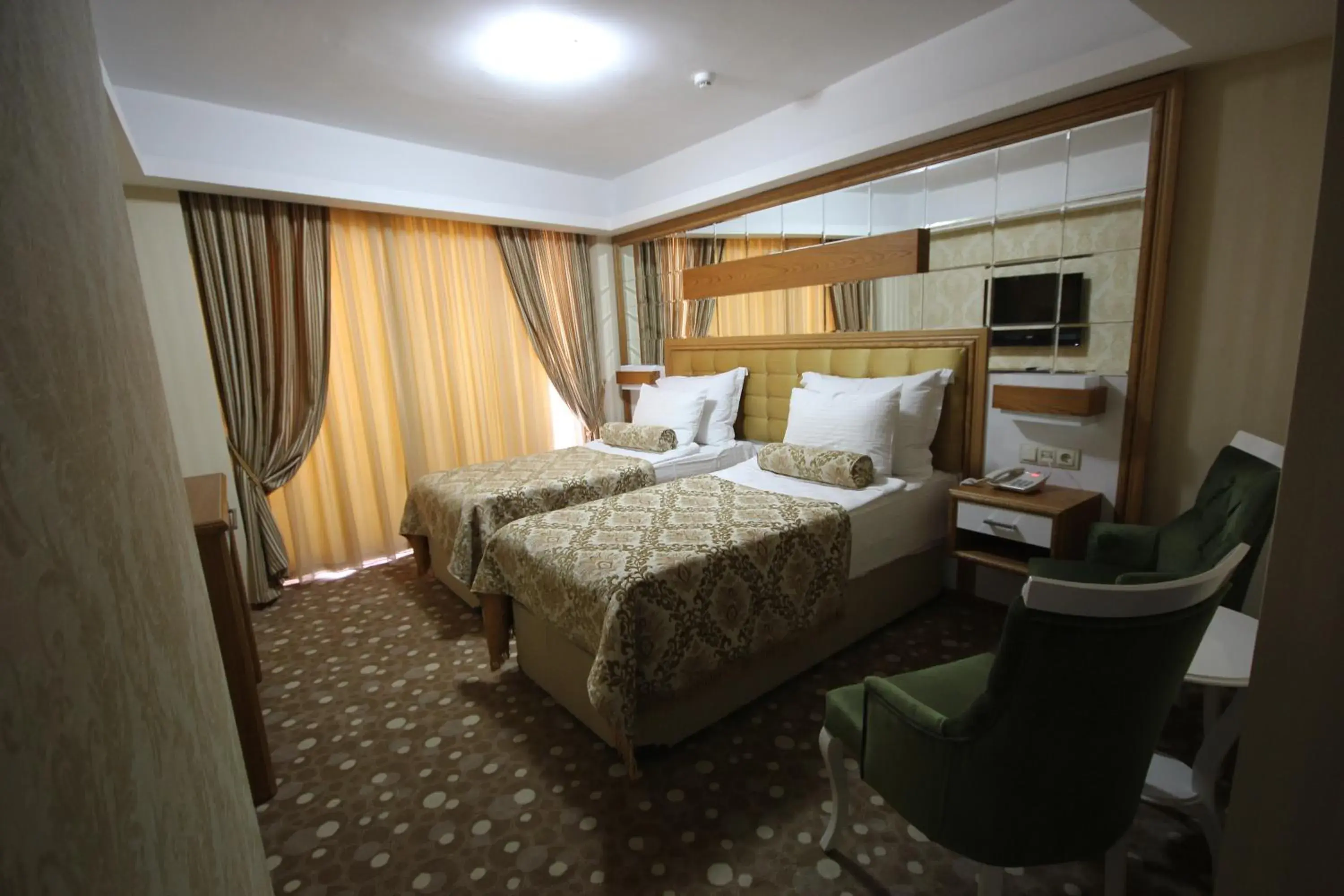 Bed in Grand Corner Boutique Hotel