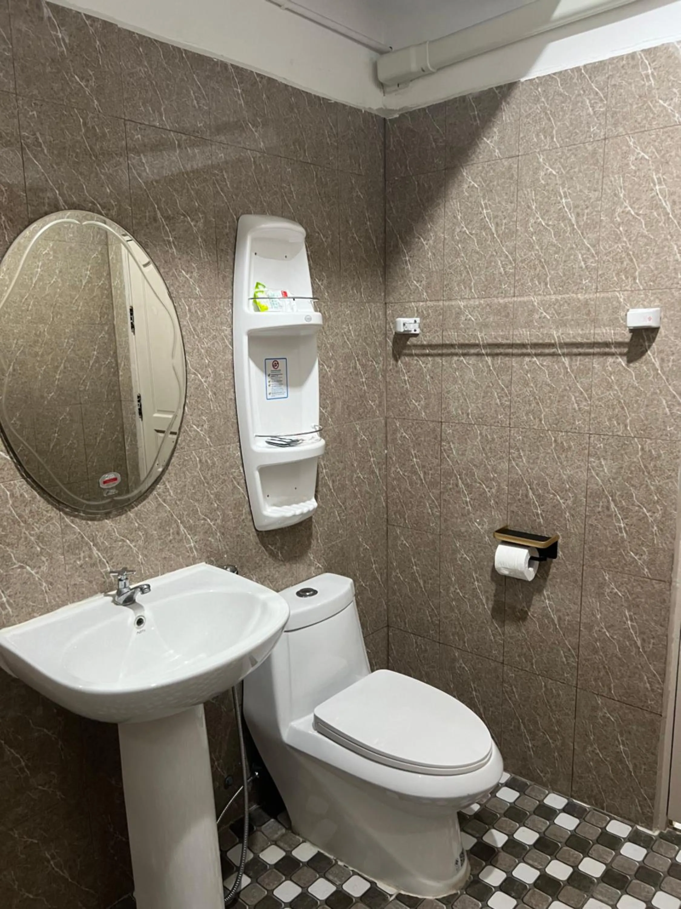 Toilet in Mall Suites Hotel